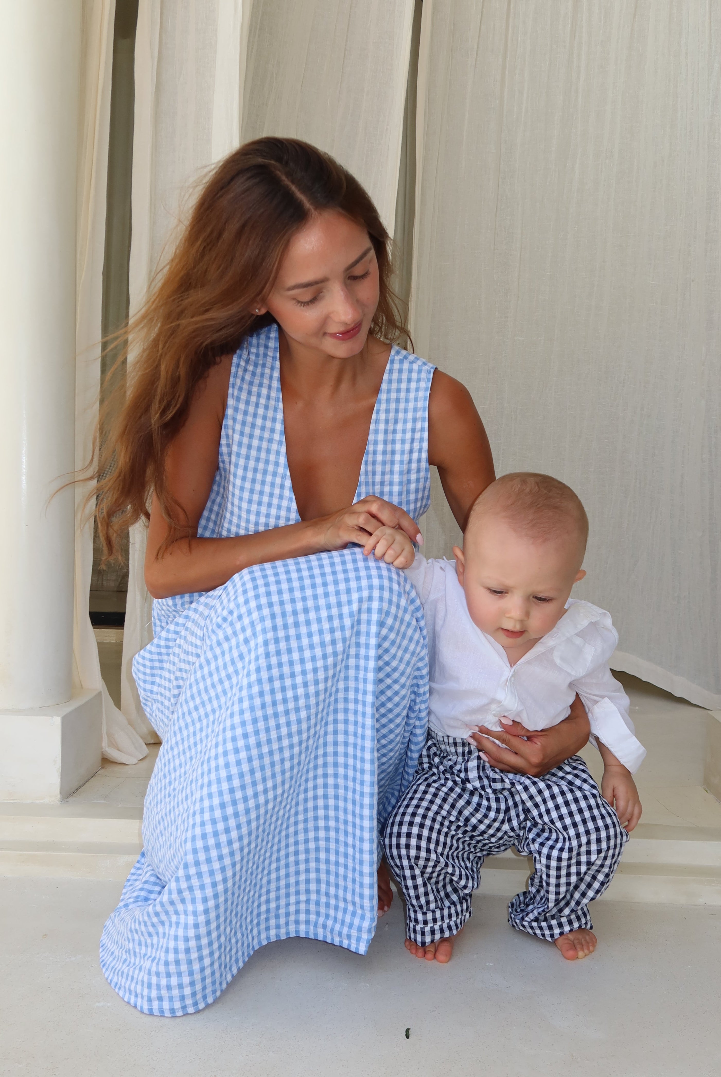 Mommy and Me photoshoot with mom and baby boy. Similar outfits that are slightly different for a family photoshoot
