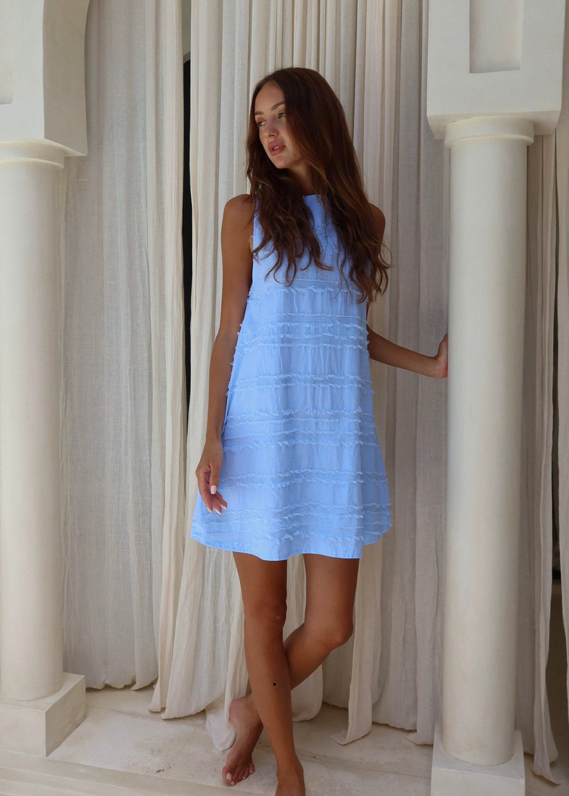 Light blue textured cotton mini dress beach club and Nantucket summer outfit 2026, vibrant Couper Exclusive reversible Mini Gili dress Puka The Label