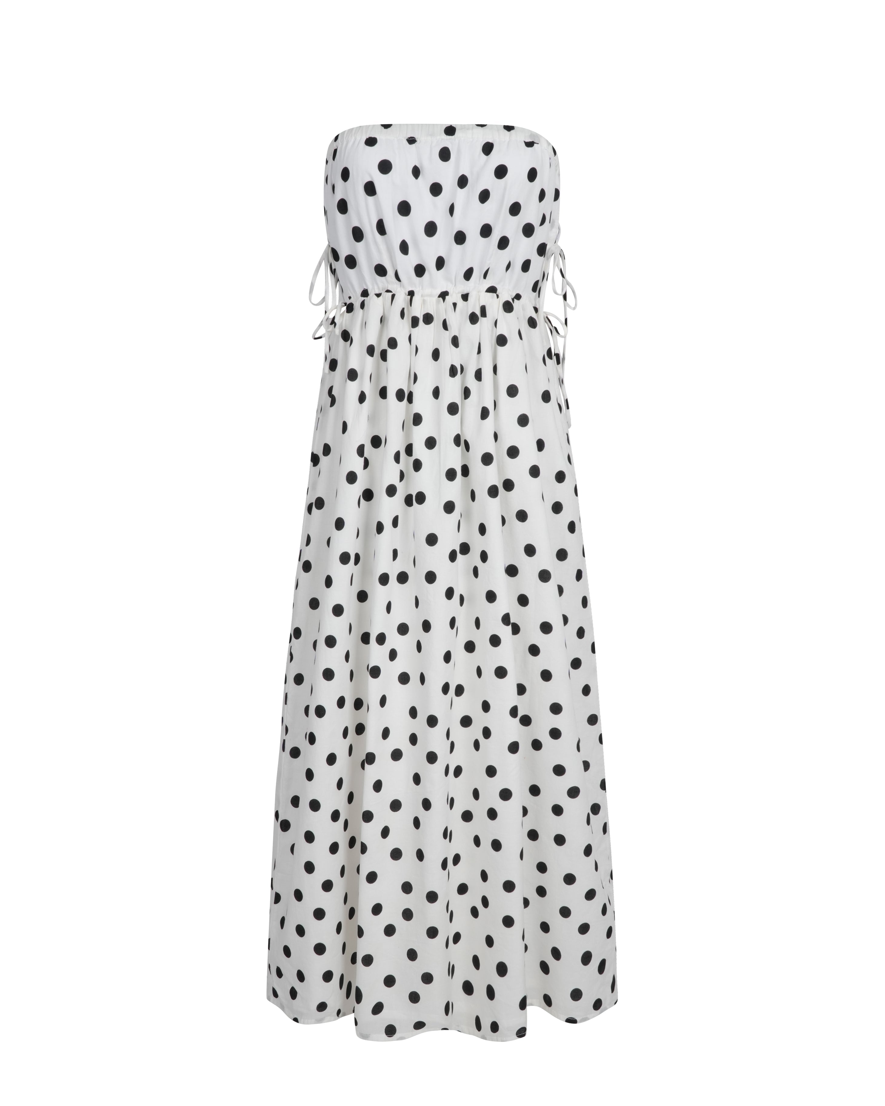White strapless dress with black polka dots on a white background