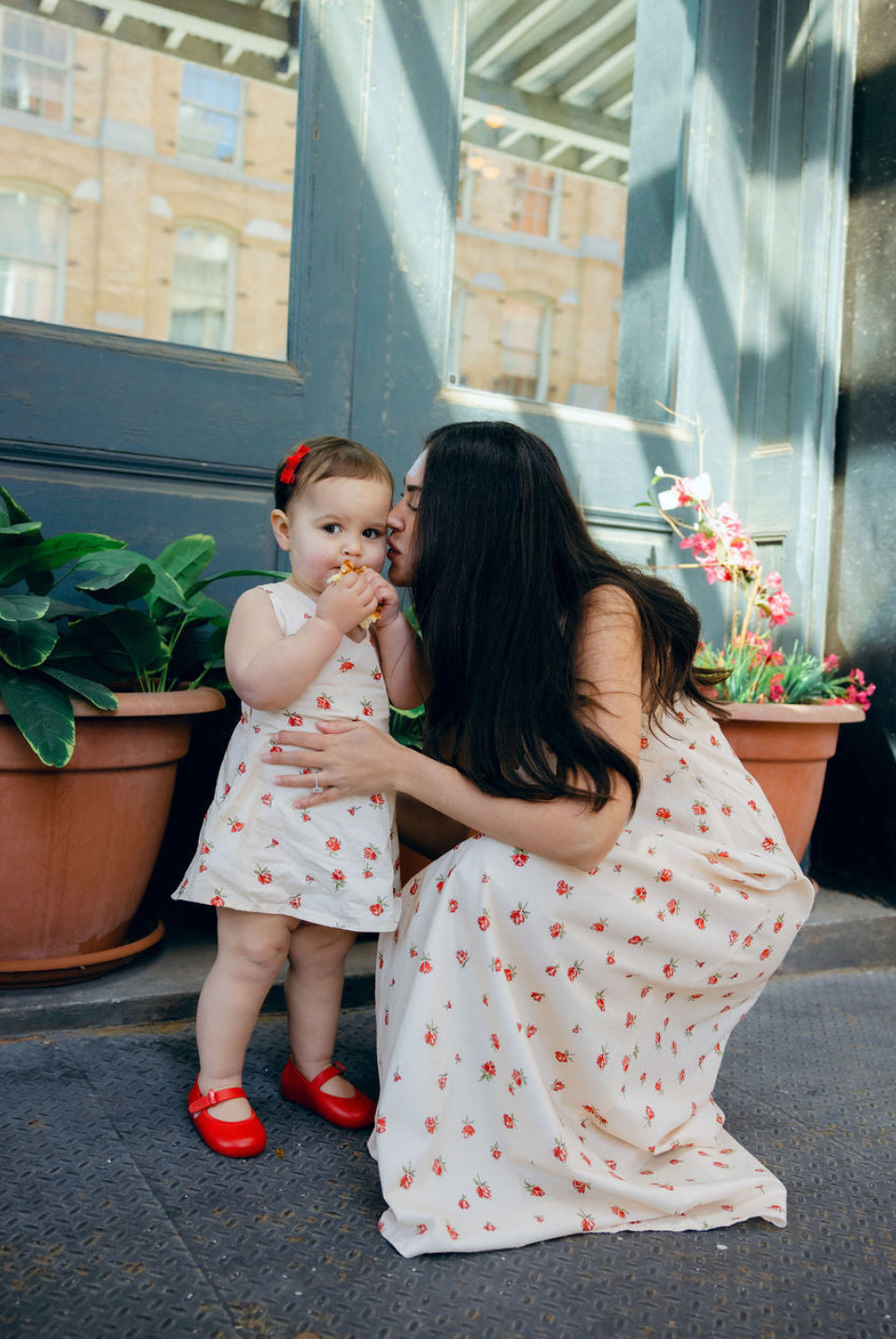 Mommy and Me matching Red Posey floral dresses at cafe brunch, Little Gili toddler girls spring Easter dress by Puka The Label