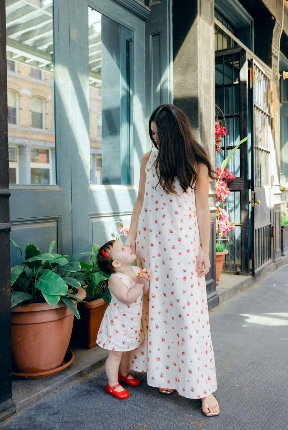 Little Gili Red Posey toddler girls floral dress close up, cream cotton red rose print spring summer Easter kids dress by Puka The Label