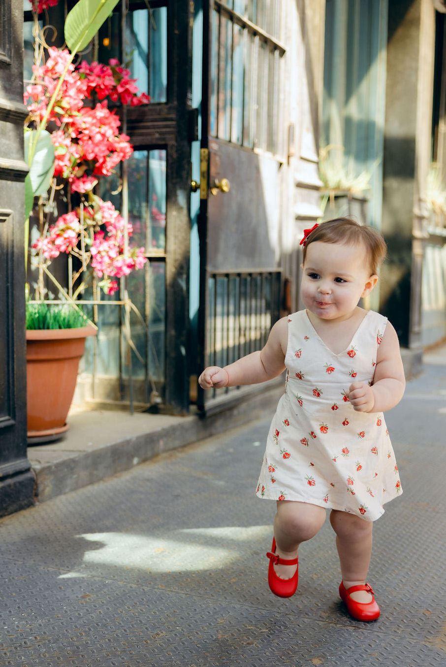 Full length Mommy and Me matching Red Posey floral dresses outdoors, Little Gili girls spring summer Easter kids dress by Puka The Label