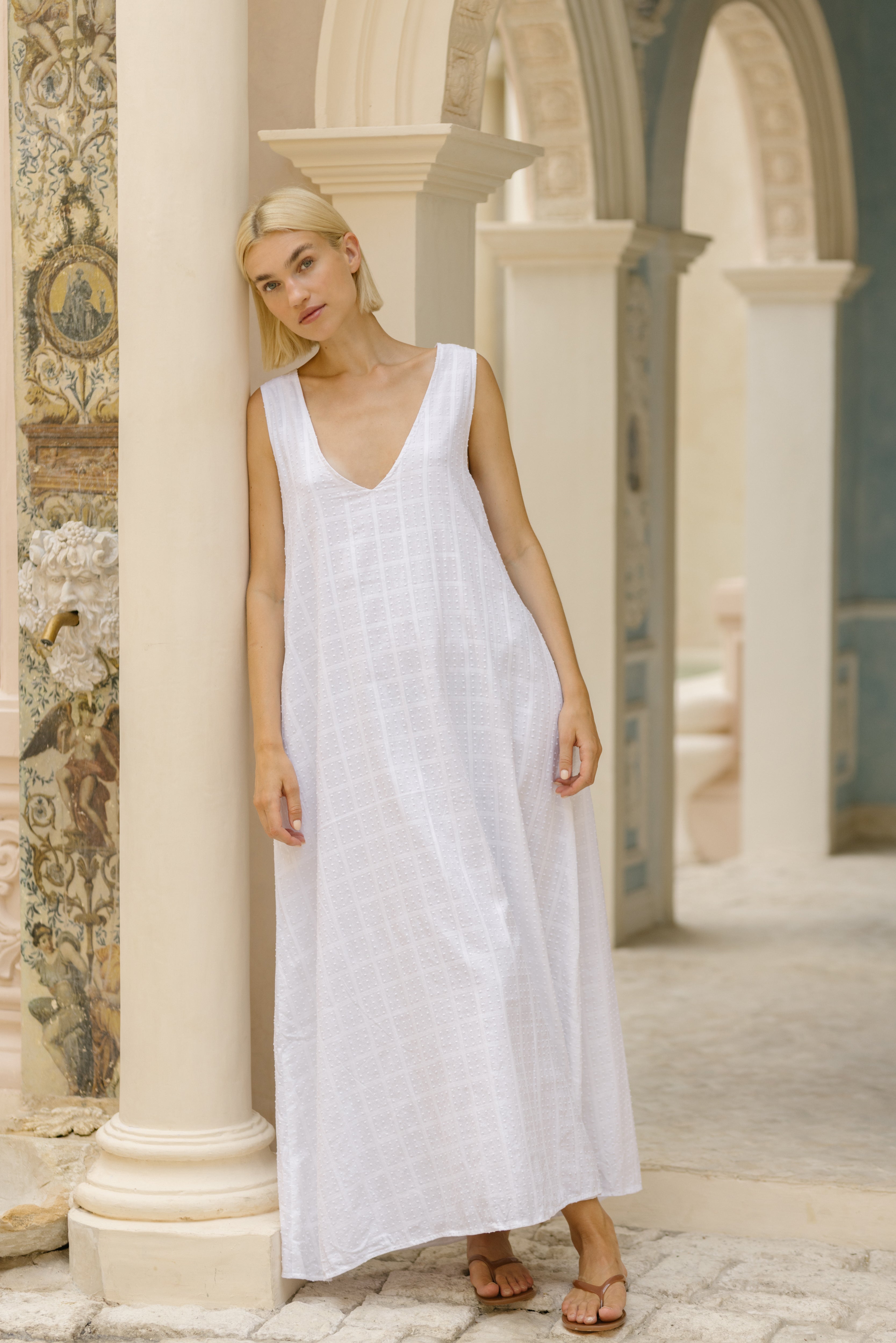 White textured cotton maxi dress rehearsal dinner outfit idea 2026, elegant destination wedding guest look for outdoor summer ceremony