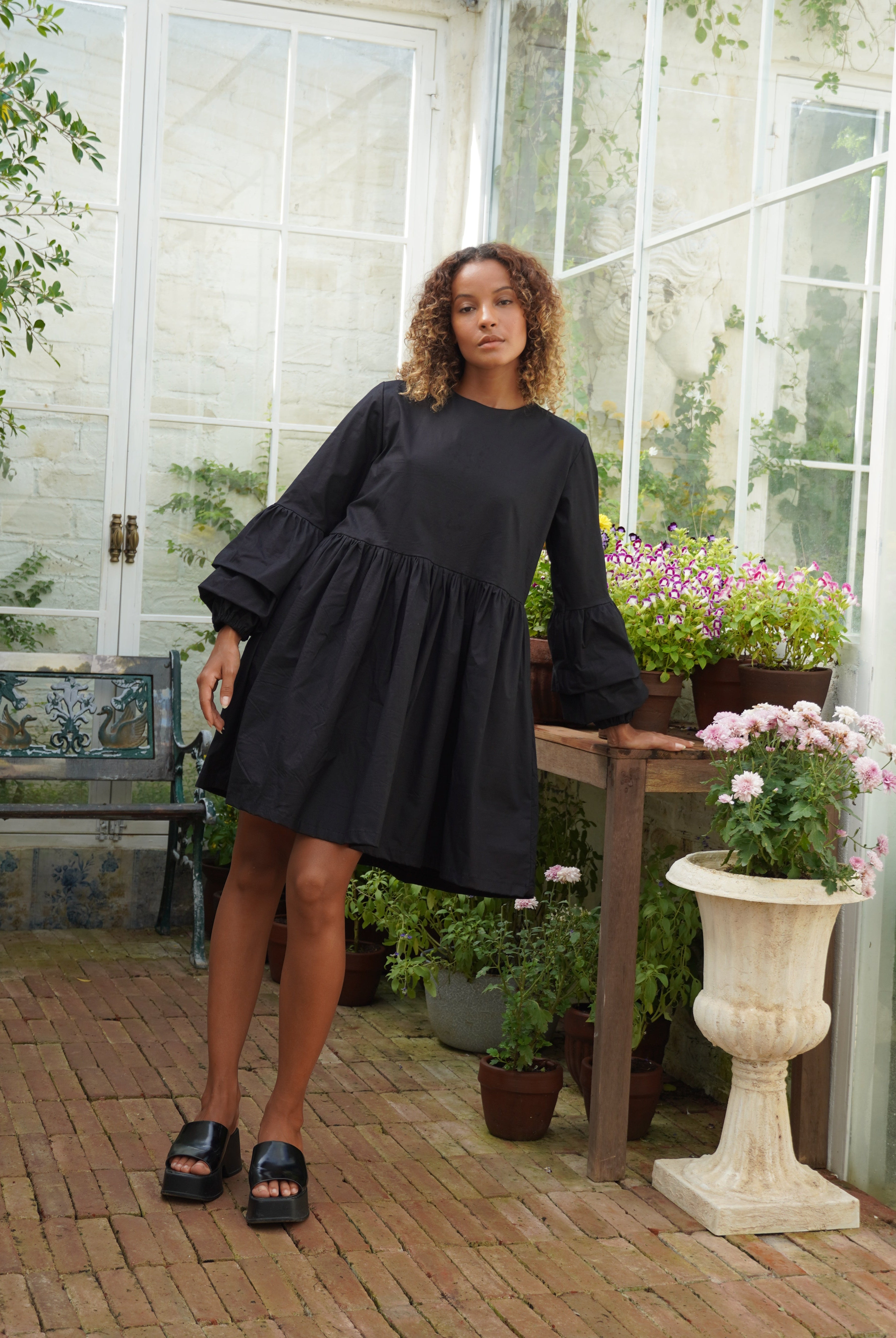 Black flattering cotton mini dress summer evening outfit 2026, ruffle sleeve Nori Dress for date night and warm weather occasion Puka The Label