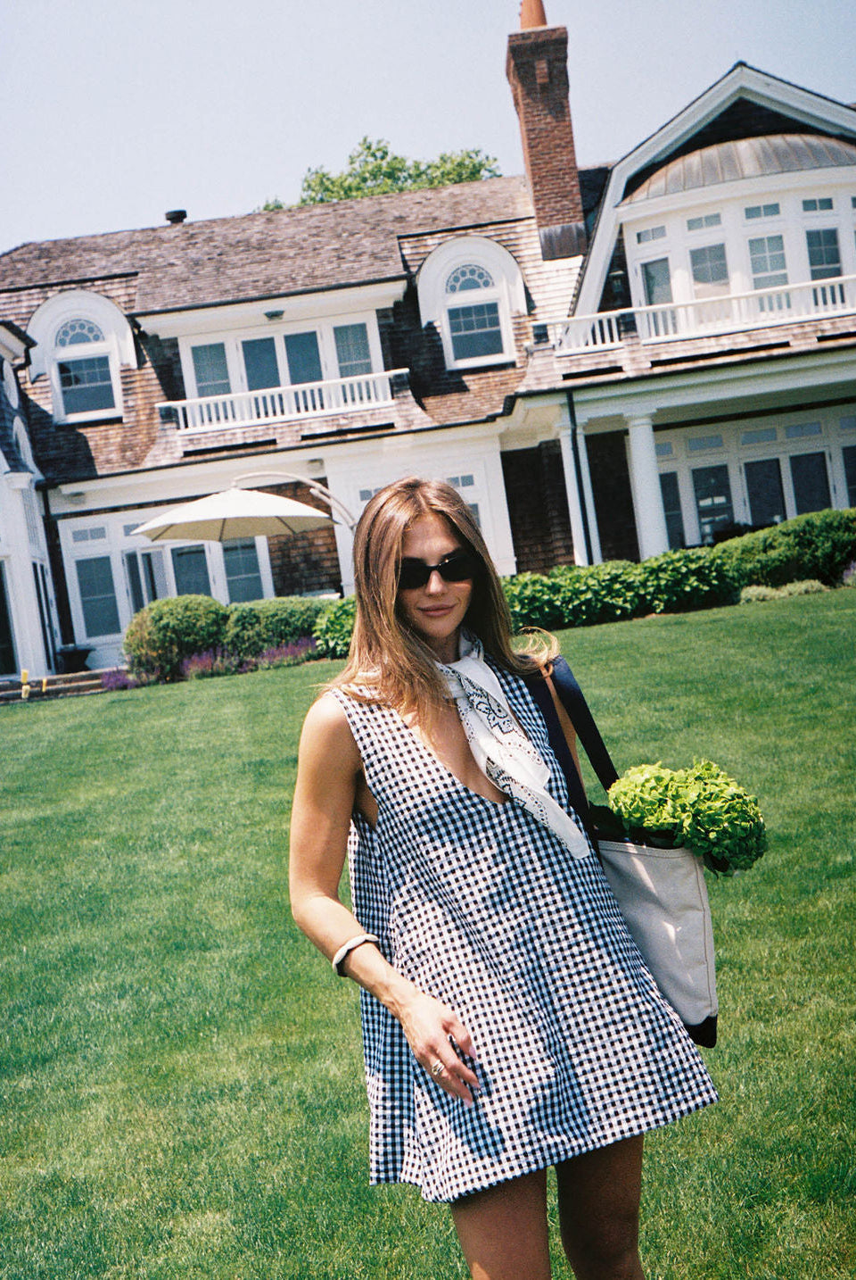 Black gingham mini Gili dress β the perfect boat day and dock cocktails outfit in reversible cotton by Puka The Label
