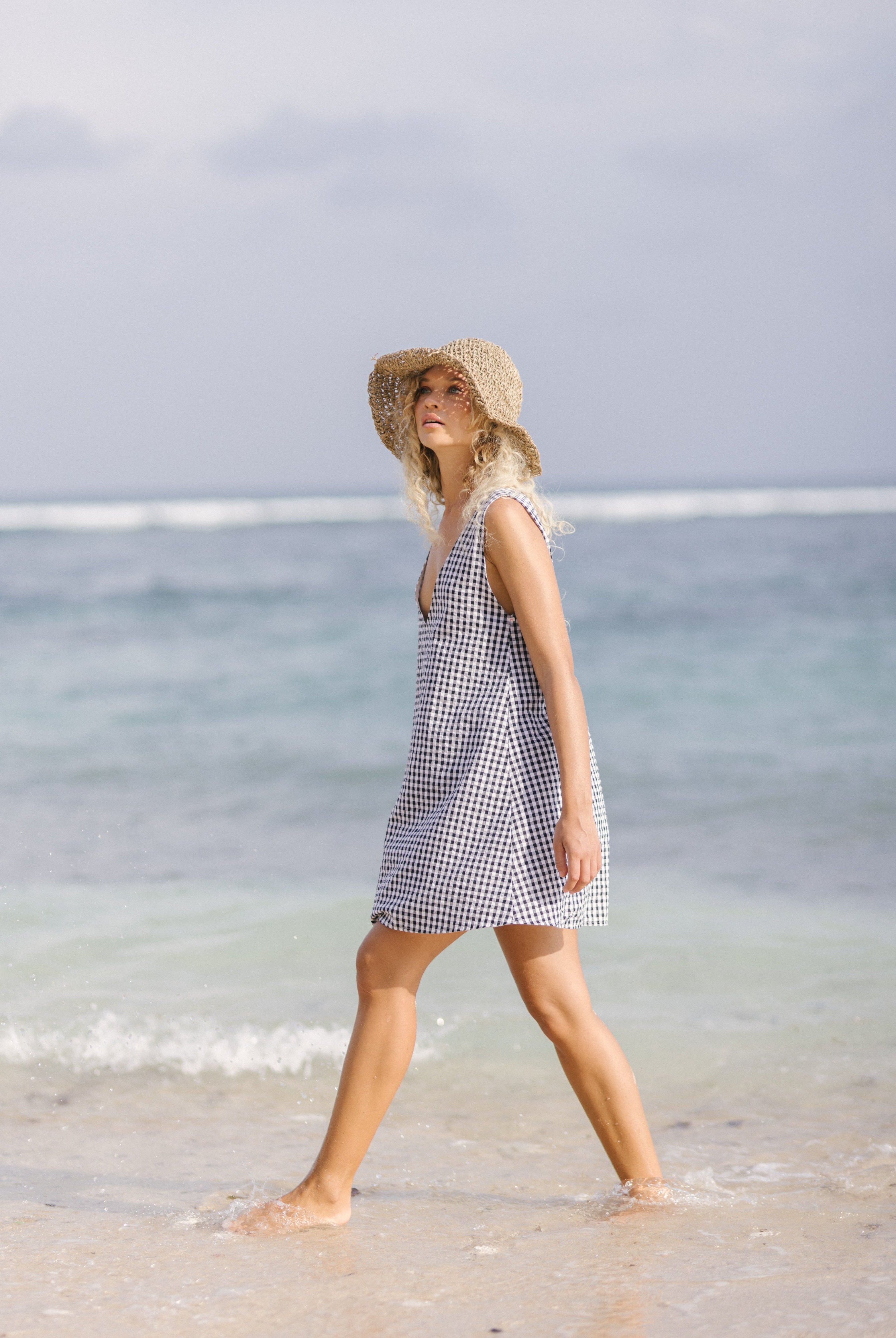 Black gingham mini Gili dress β girls trip and resort style in reversible cotton mini by Puka The Label