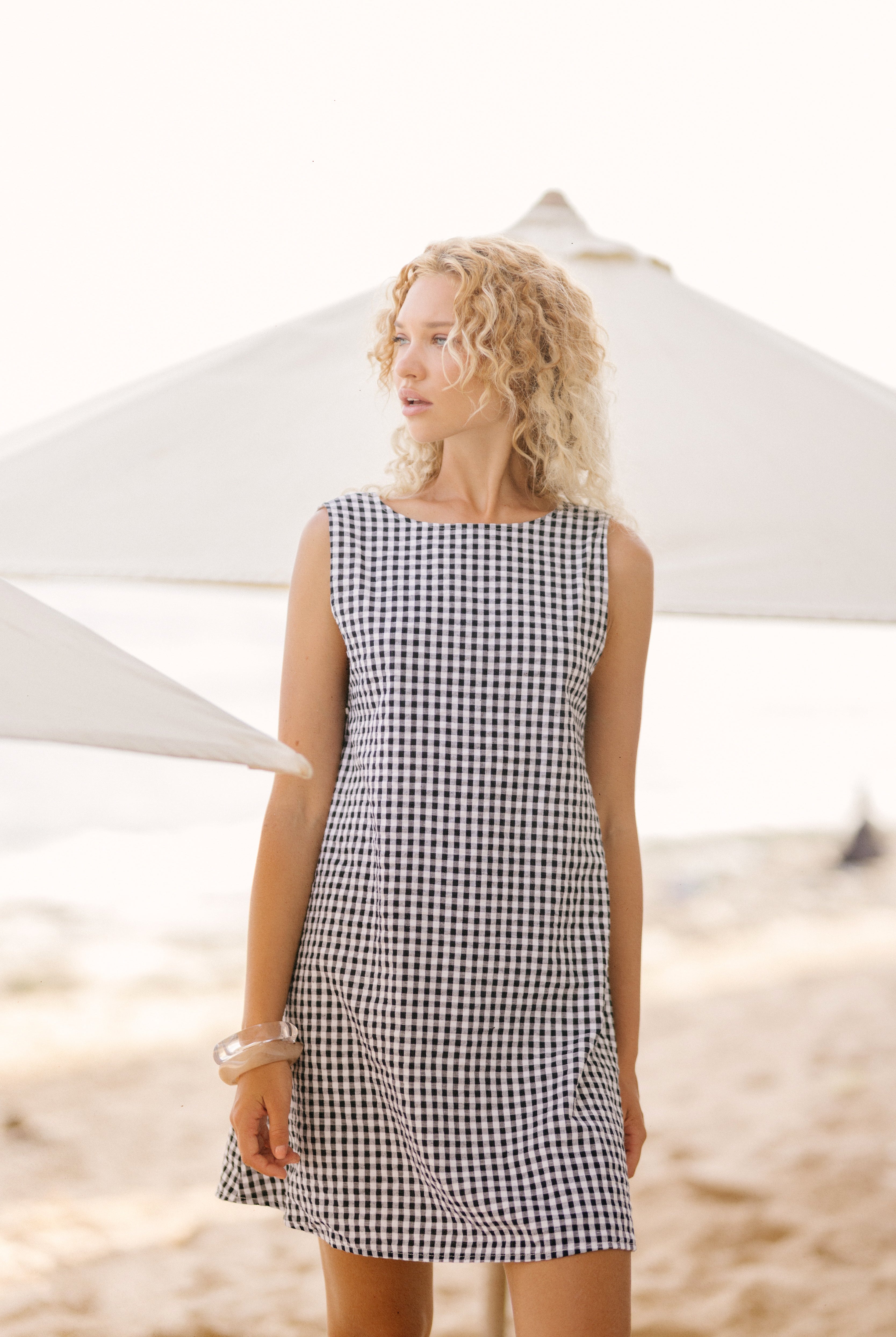 Black gingham mini Gili dress β the perfect Labor Day weekend outfit, reversible for two looks in one by Puka The Label