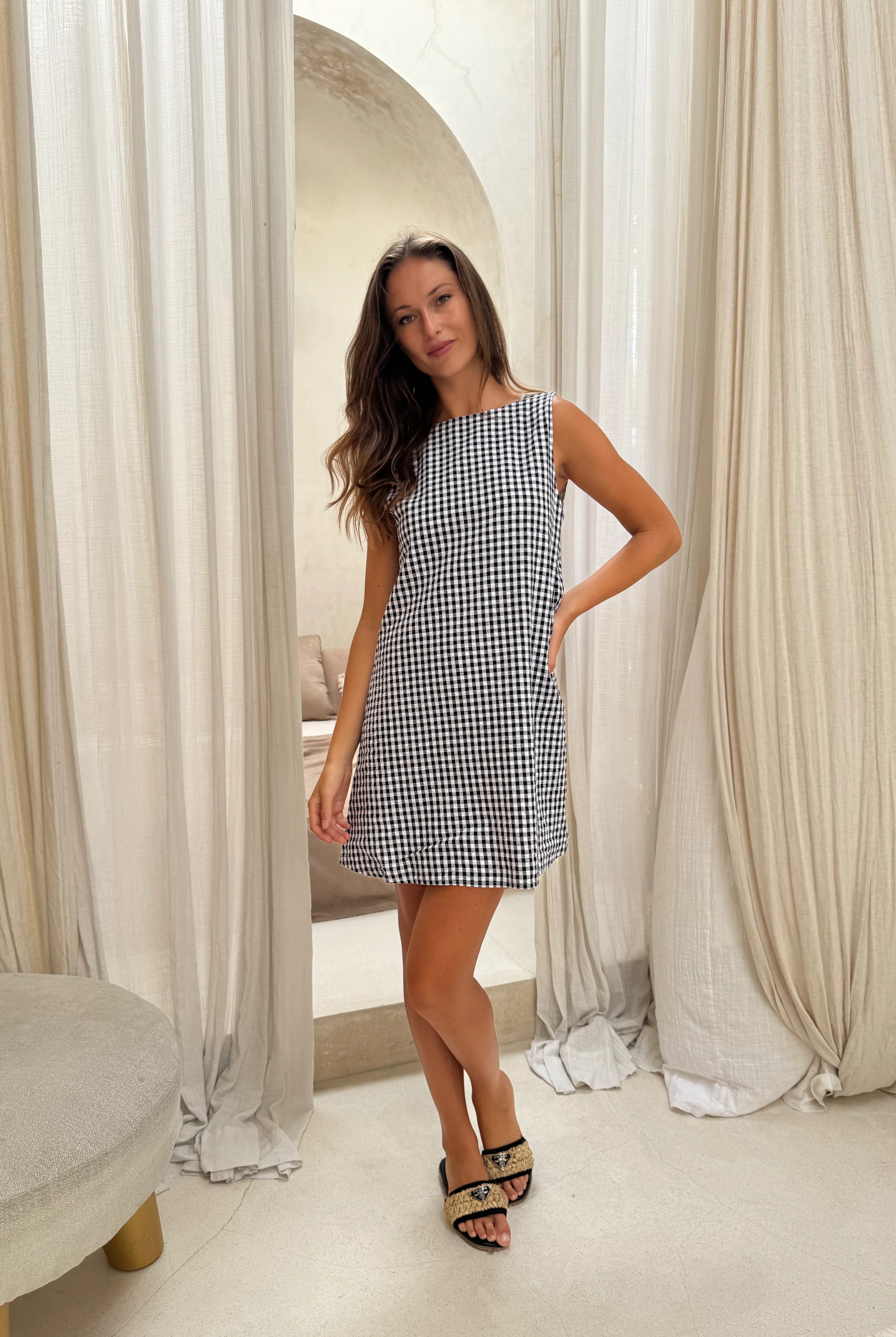 Black gingham mini Gili dress β close-up of the reversible V-neck and high neck neckline detail by Puka The Label