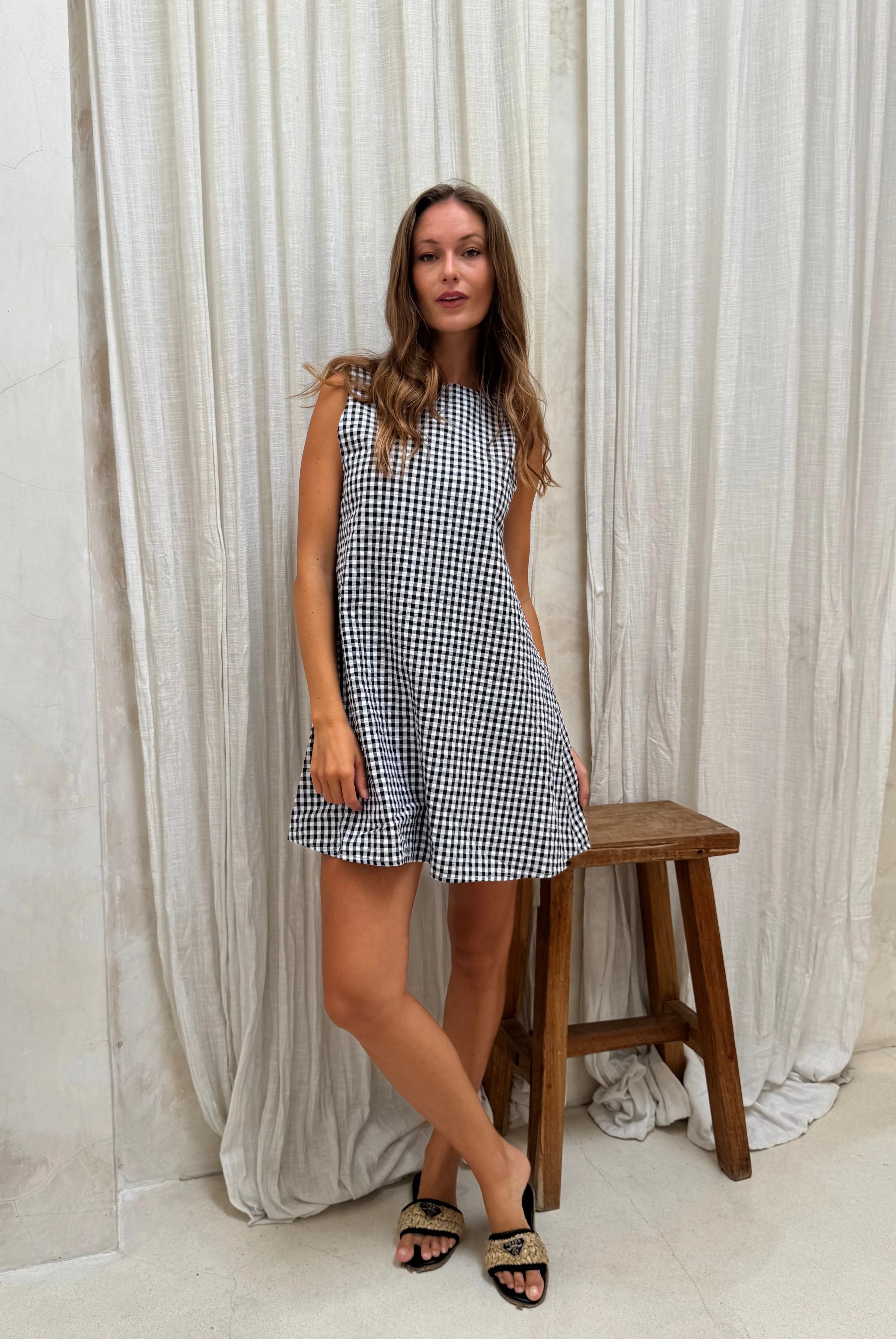 Black gingham mini Gili dress β studio detail of the classic gingham check cotton fabric by Puka The Label