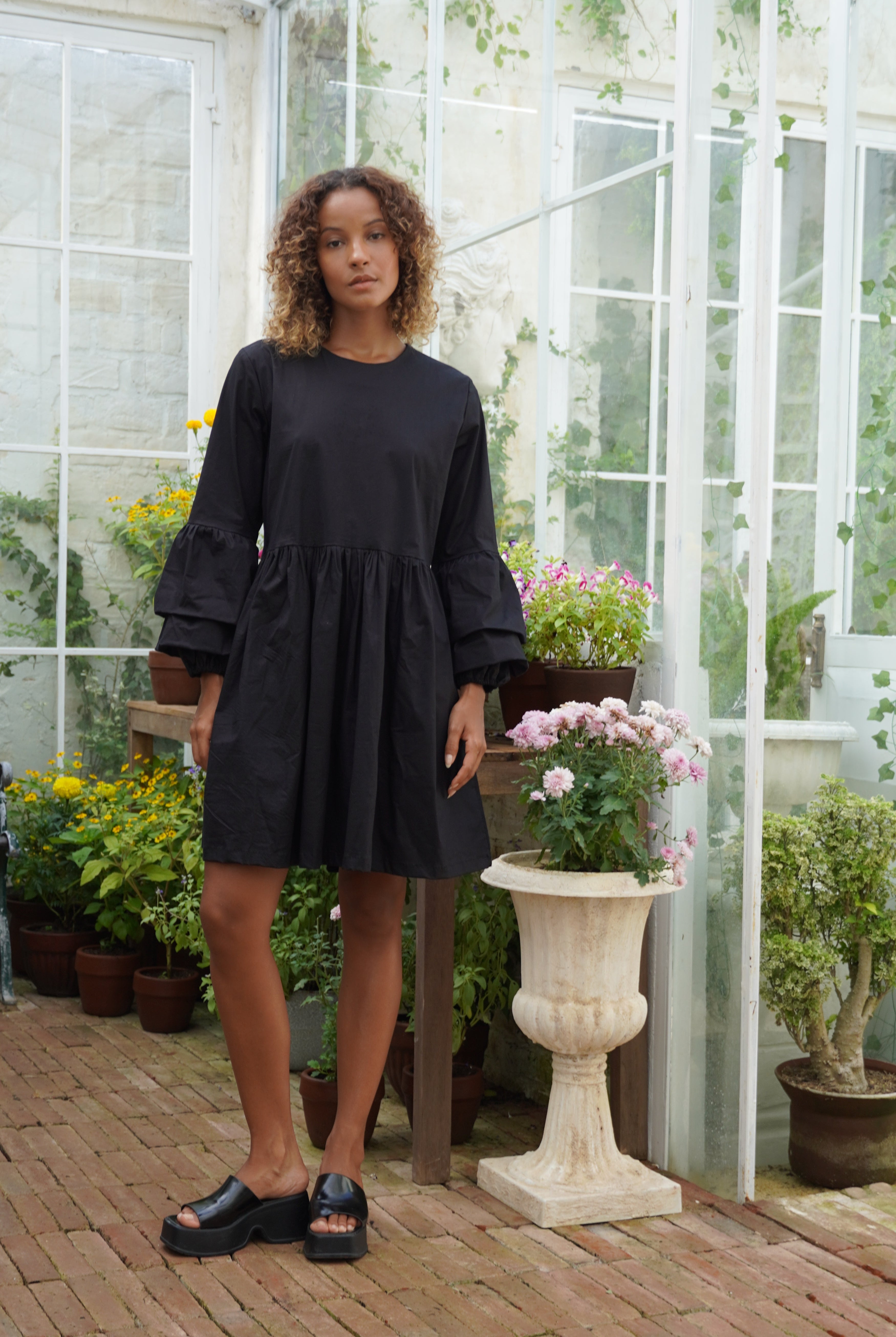 Black ruffle sleeve cotton mini dress bachelorette weekend outfit summer 2026, fun elevated mini dress for girls trip and coastal celebration