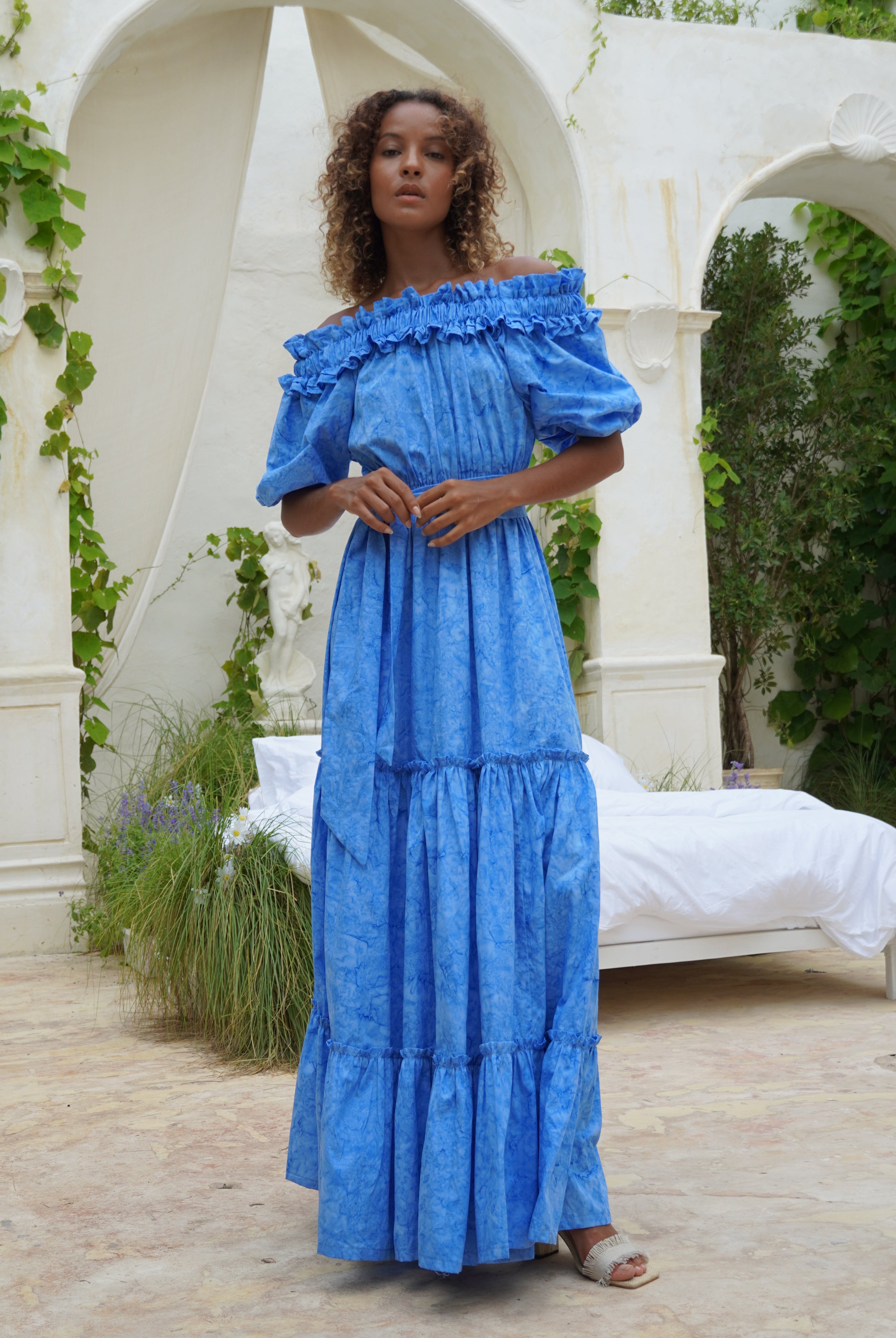 Blue off the shoulder formal maxi dress coastal wedding guest outfit idea, flowing tiered cotton dress summer celebration