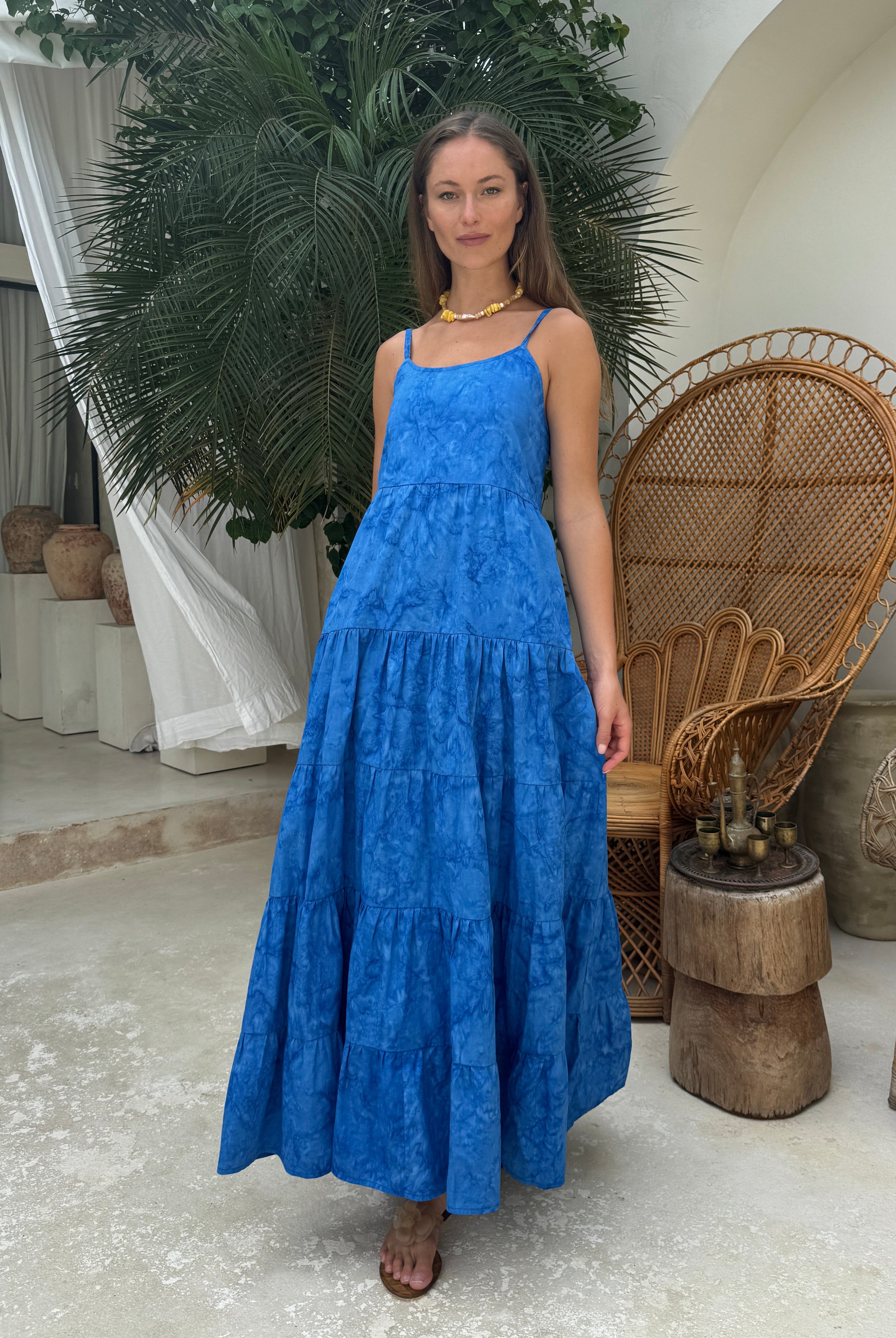 Cobalt blue tiered maxi dress black tie optional summer party outfit 2026, vibrant hand-dyed cotton dress for rooftop celebration and outdoor gala