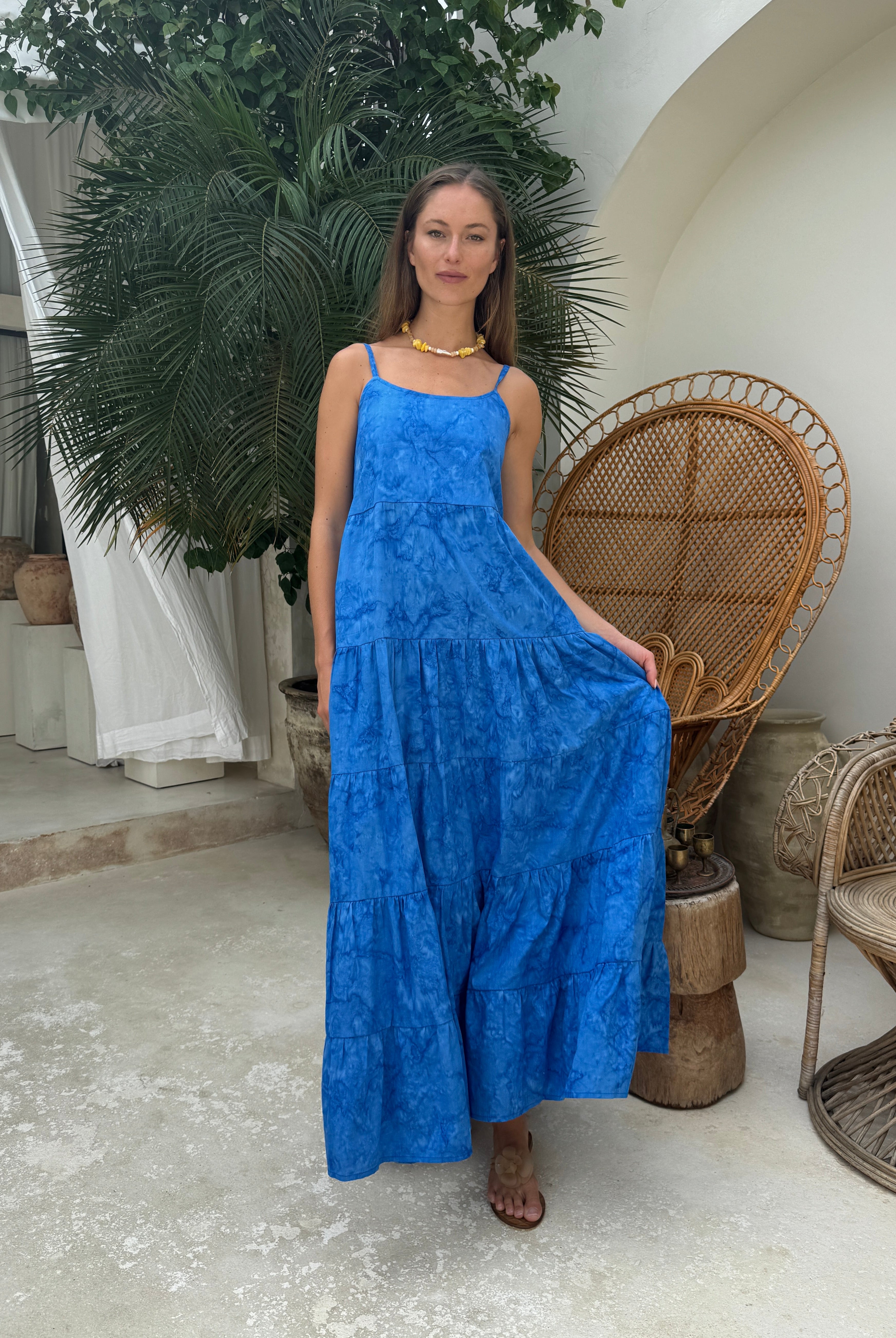 Cobalt blue tiered maxi dress black tie optional summer party outfit 2026, vibrant hand-dyed cotton dress for rooftop celebration and outdoor gala