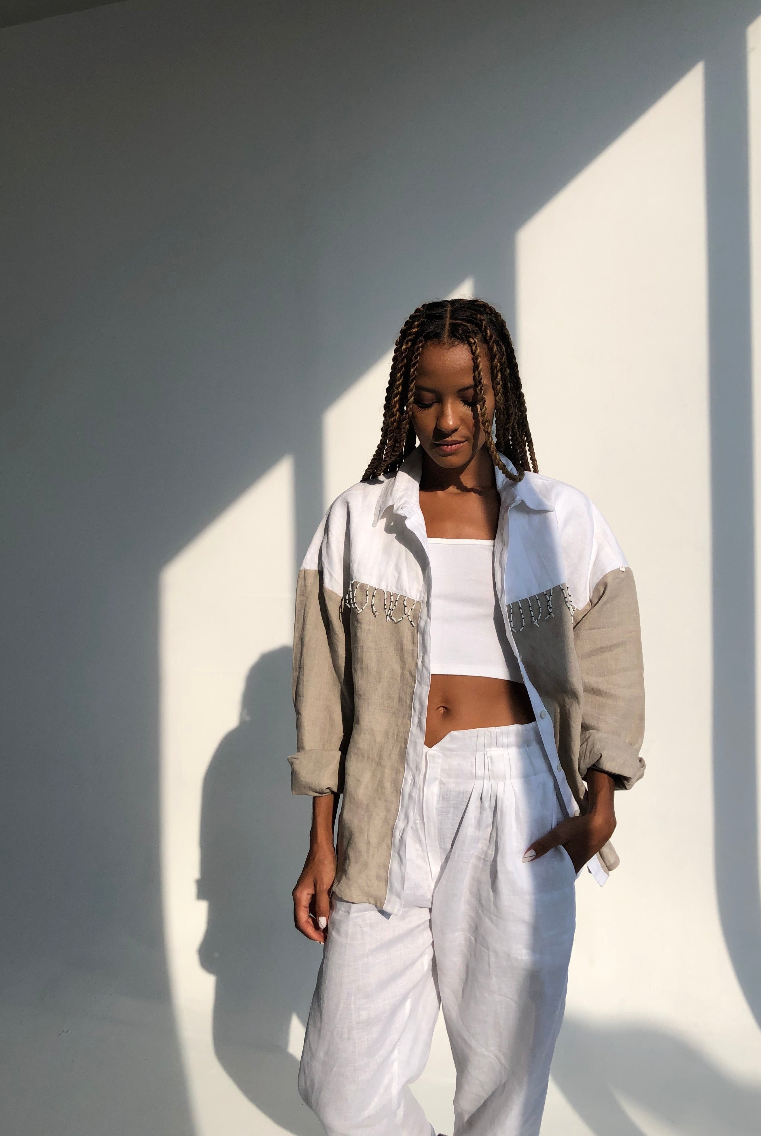 Model wearing Puka The Label color block Ulu fringe button-up — ranch chic western blouse with black and white fringe detail