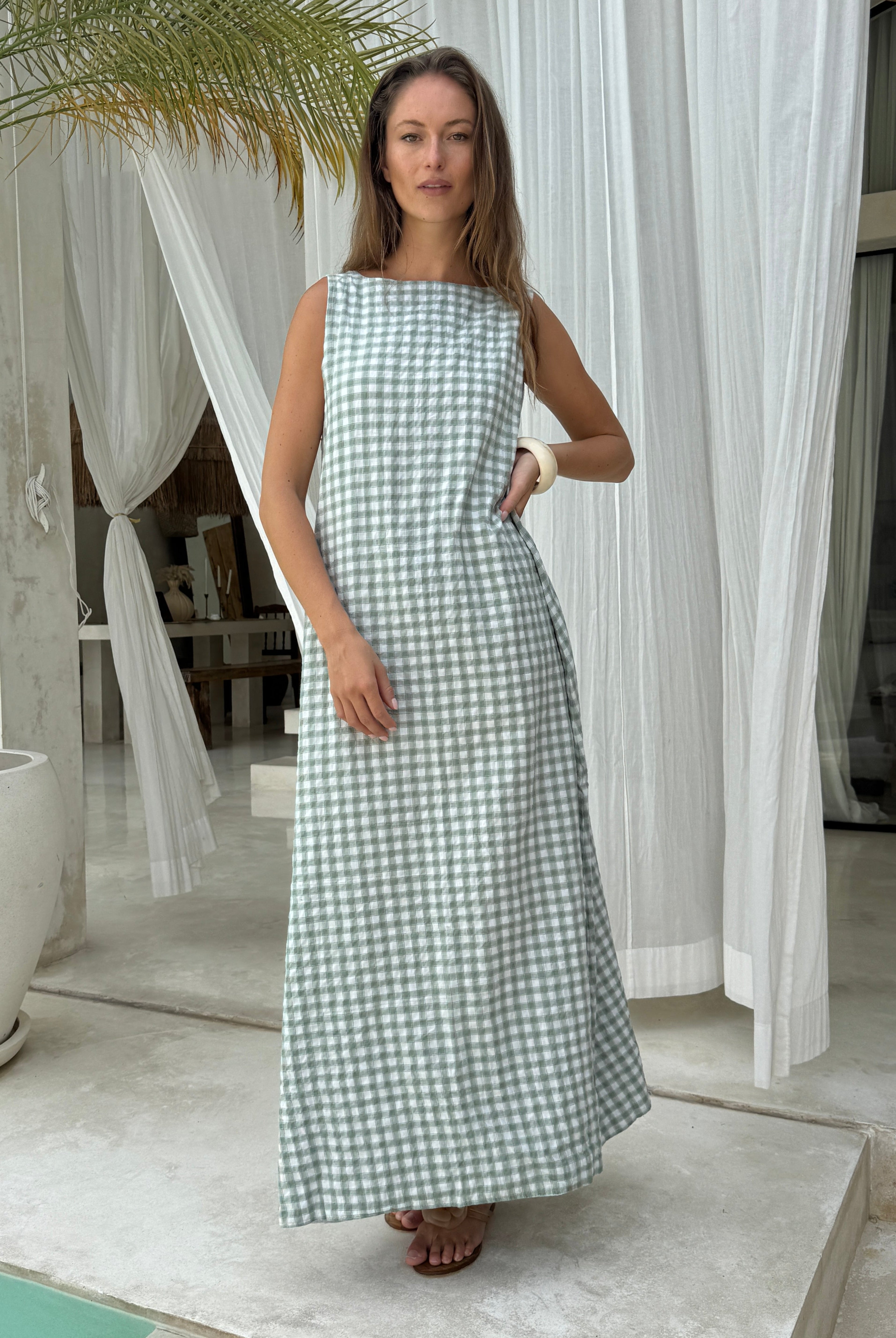 Close-up of green gingham cotton fabric, lightweight breathable check print maxi dress perfect for summer vacation Puka The Label