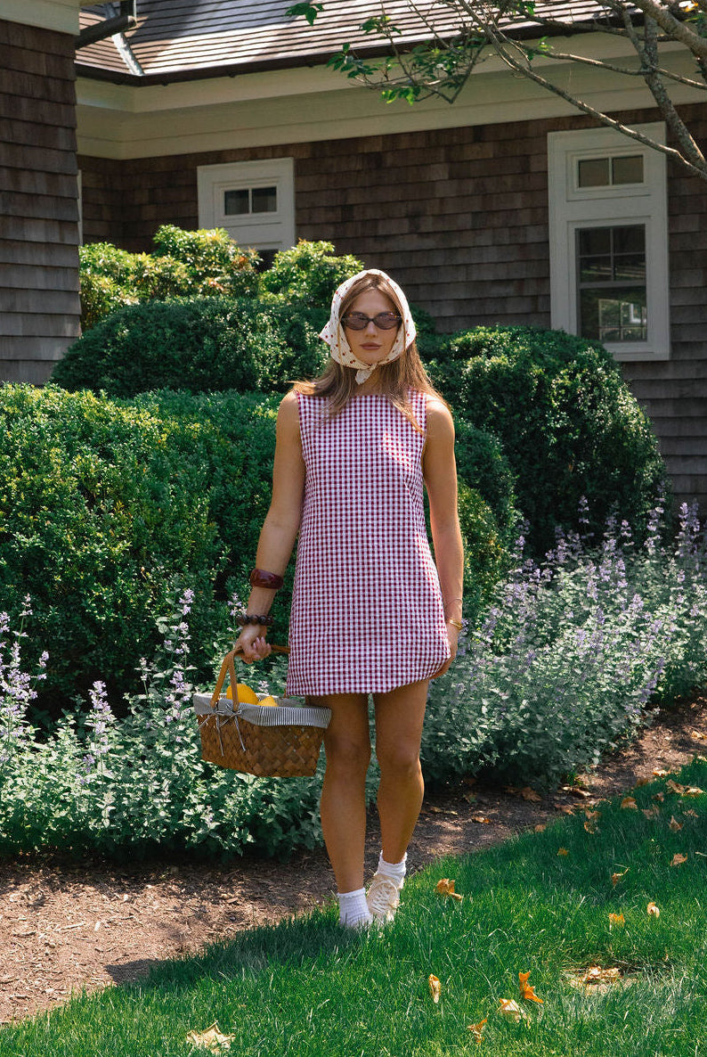 Influencer Hannah Lovey Style wearing red gingham mini dress by Puka The Label styled out east, summer outfit, casual beach dress, influencer fashion