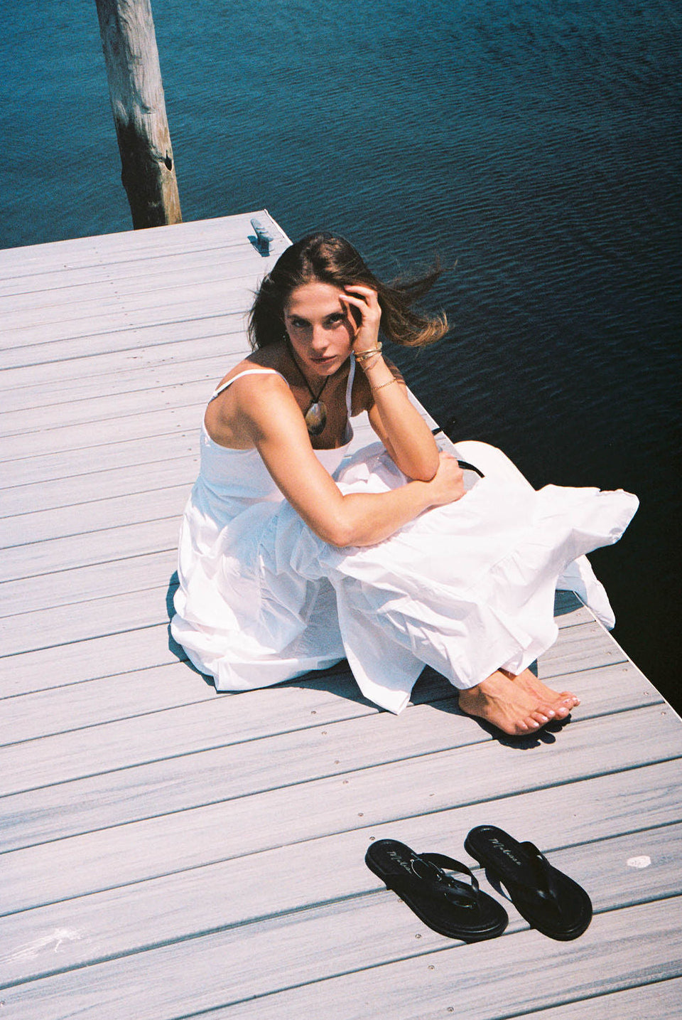 Hannah Lovey white Waverly Dress out east summer styling outfit 2026, tiered cotton maxi dress for Hamptons coastal occasion Puka The Label