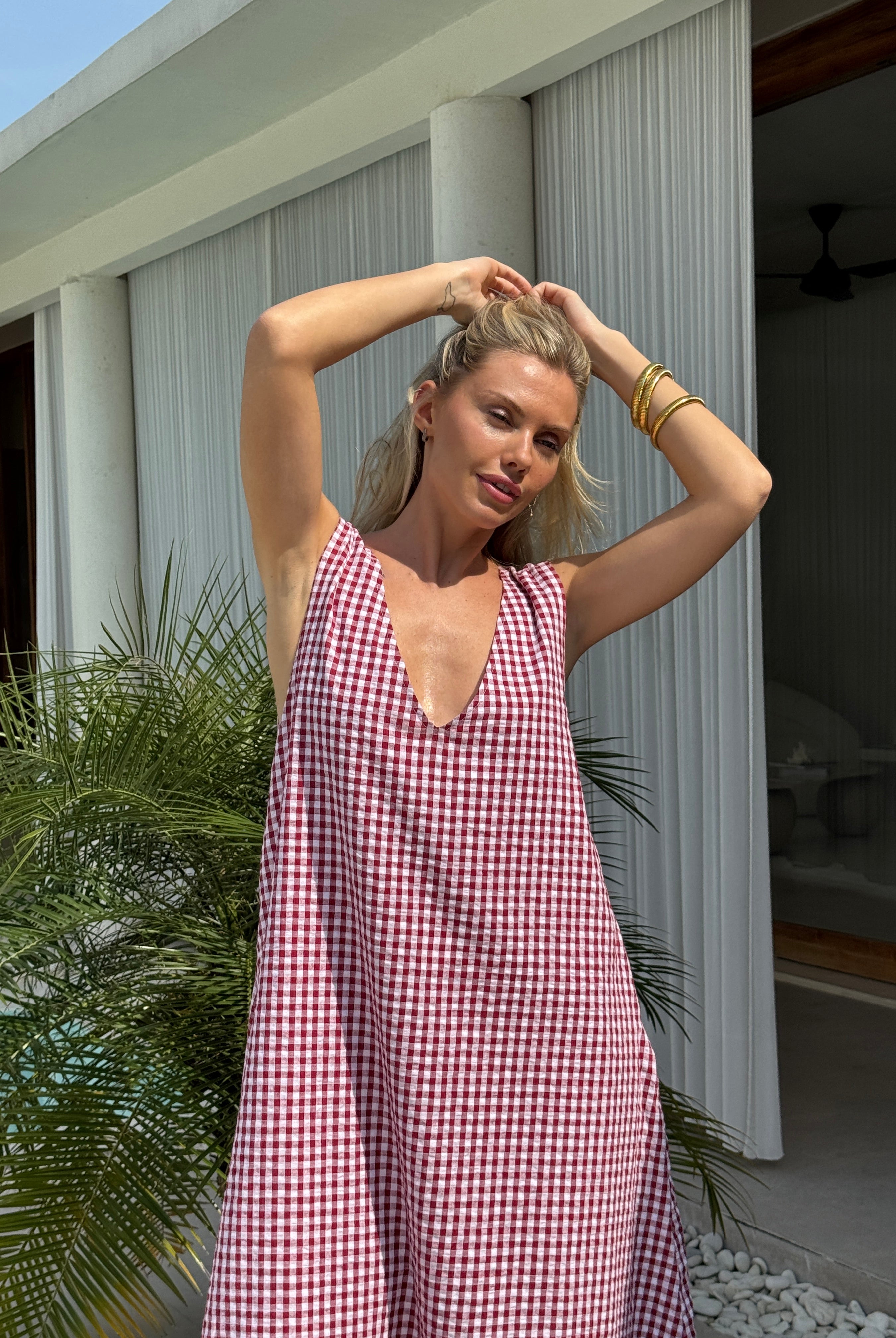 Maroon gingham Gili maxi dress showing reversible V-neck and high neck styling options, Puka The Label