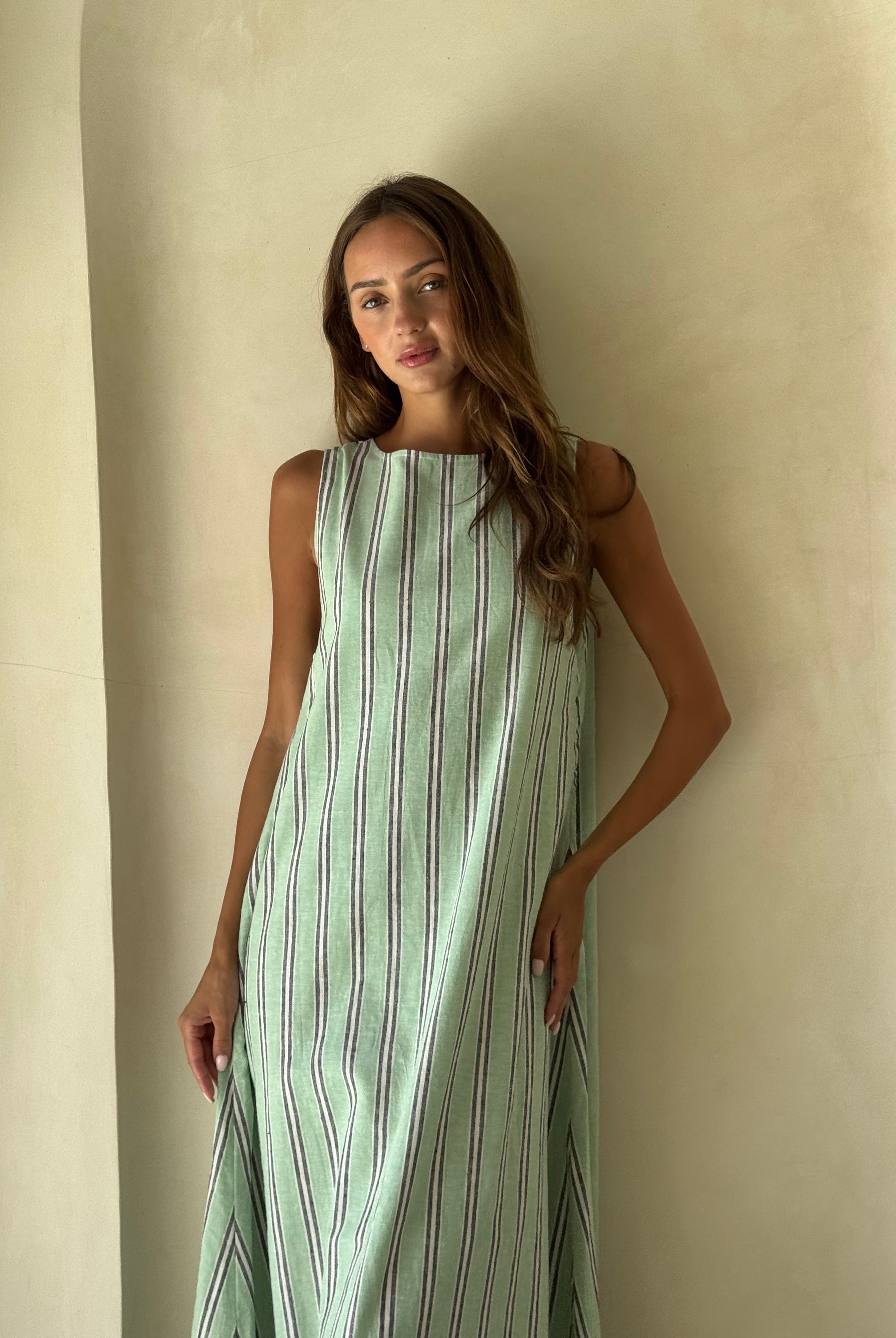Gili Stripe Maxi Dress in navy and white worn as a relaxed resort wear look for a coastal summer getaway