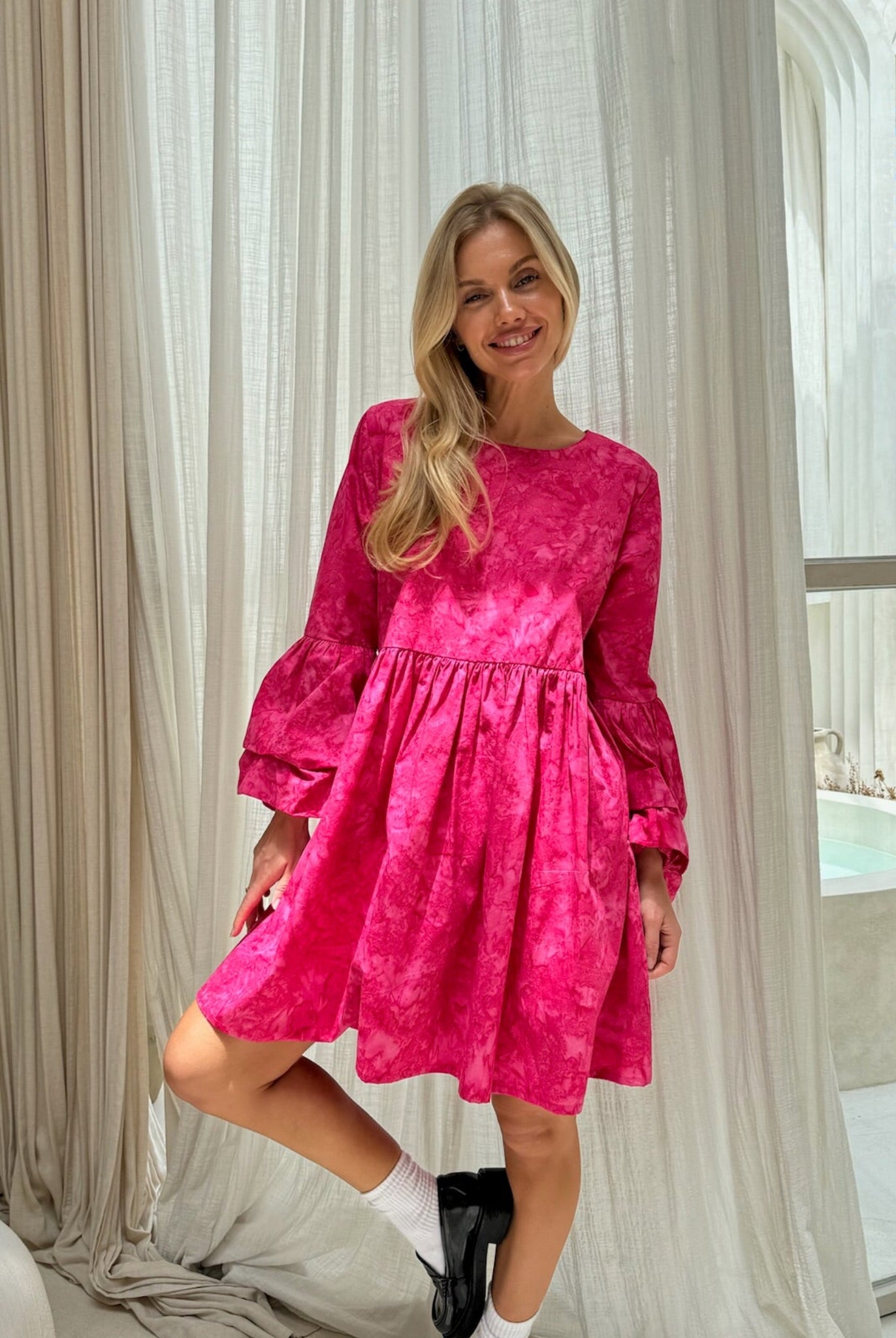 Pink hand-dyed cotton ruffle sleeve mini dress bridal shower outfit spring 2026, playful feminine dress for outdoor celebration and garden party
