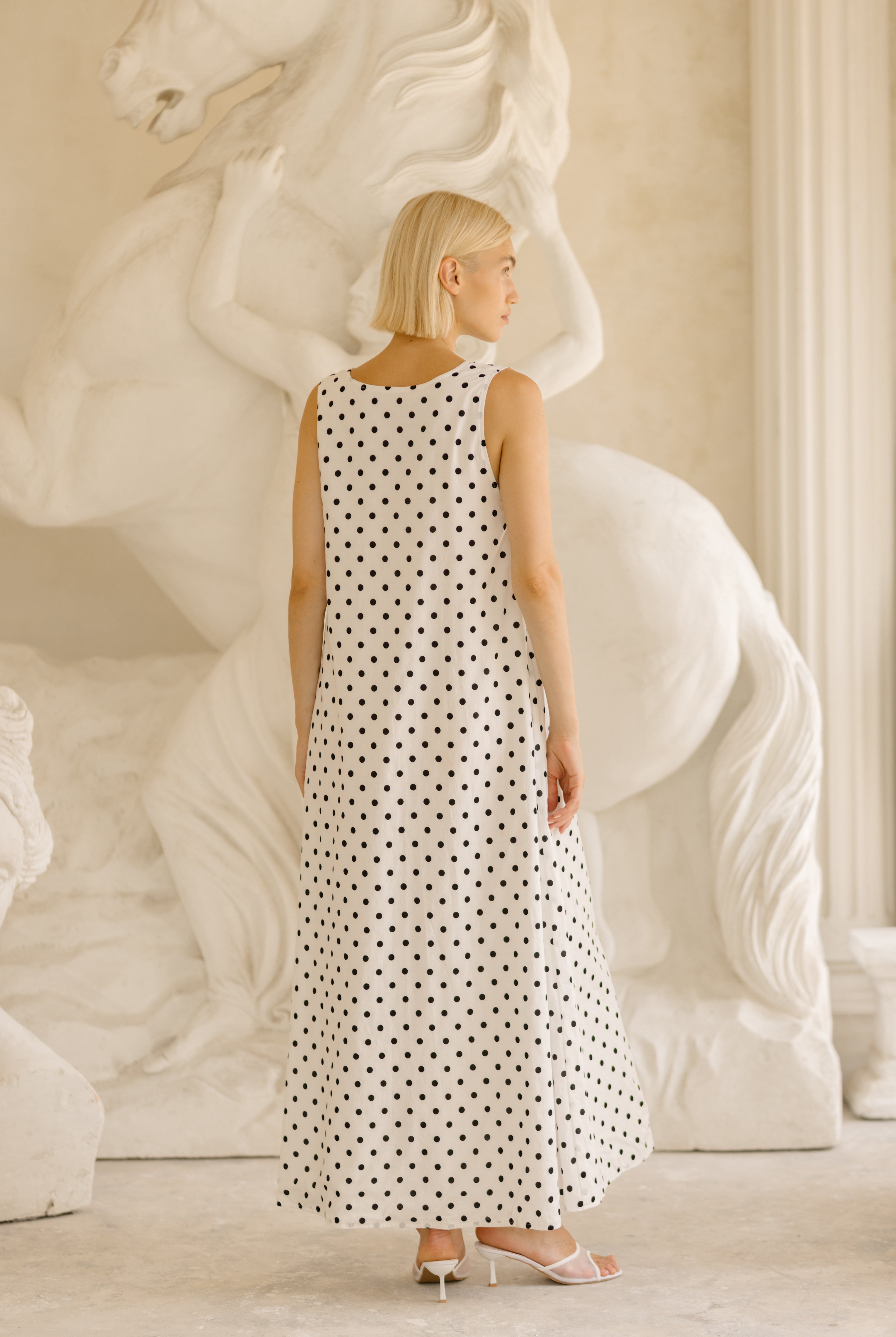 Polka dot maxi dress Kentucky Derby outfit idea 2026, classic black and white cotton dress for race day, outdoor luncheon, and spring event