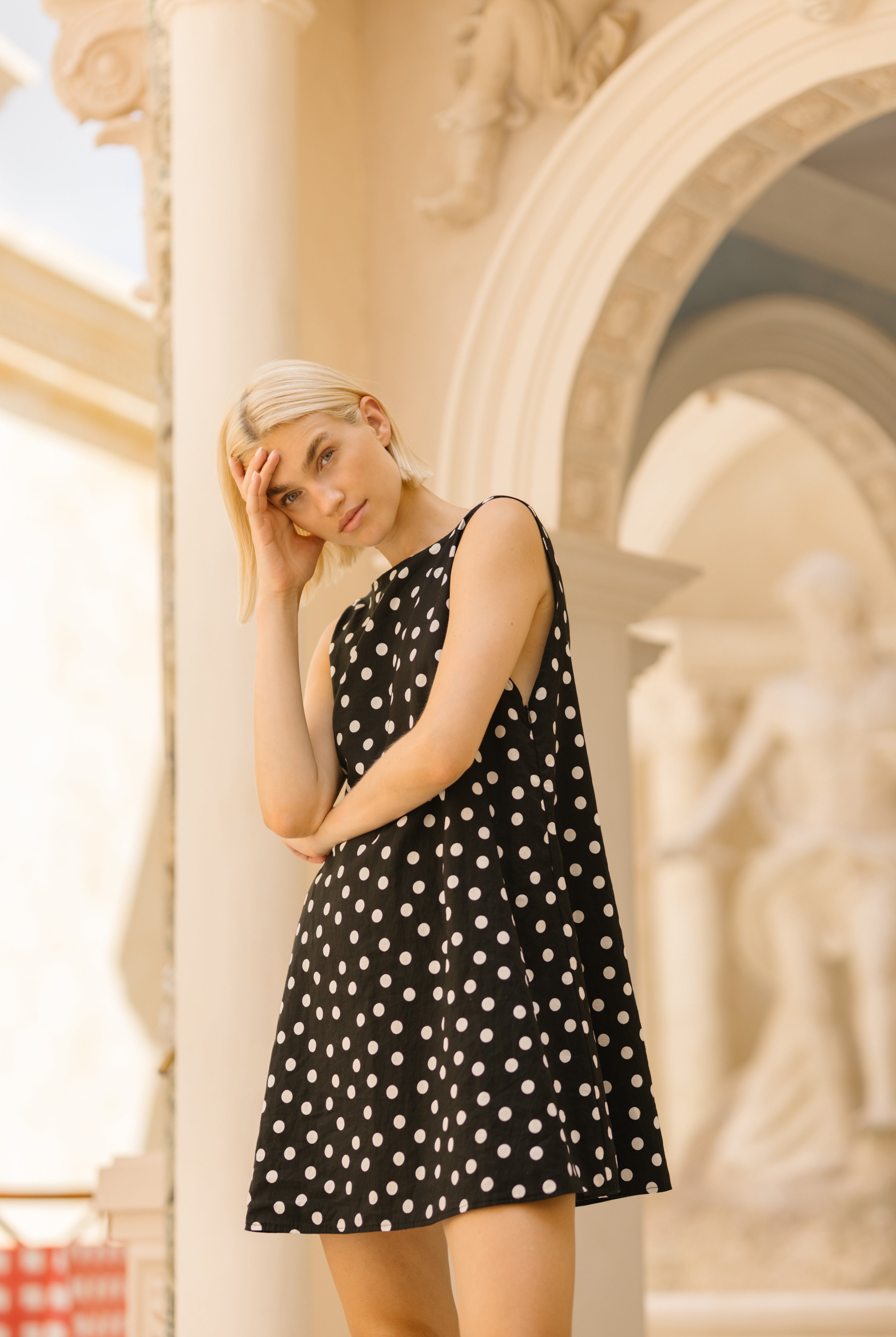 Polka dot mini dress bachelorette party outfit idea 2026, fun black and white short cotton dress for girls trip, beach weekend, and resort getaway