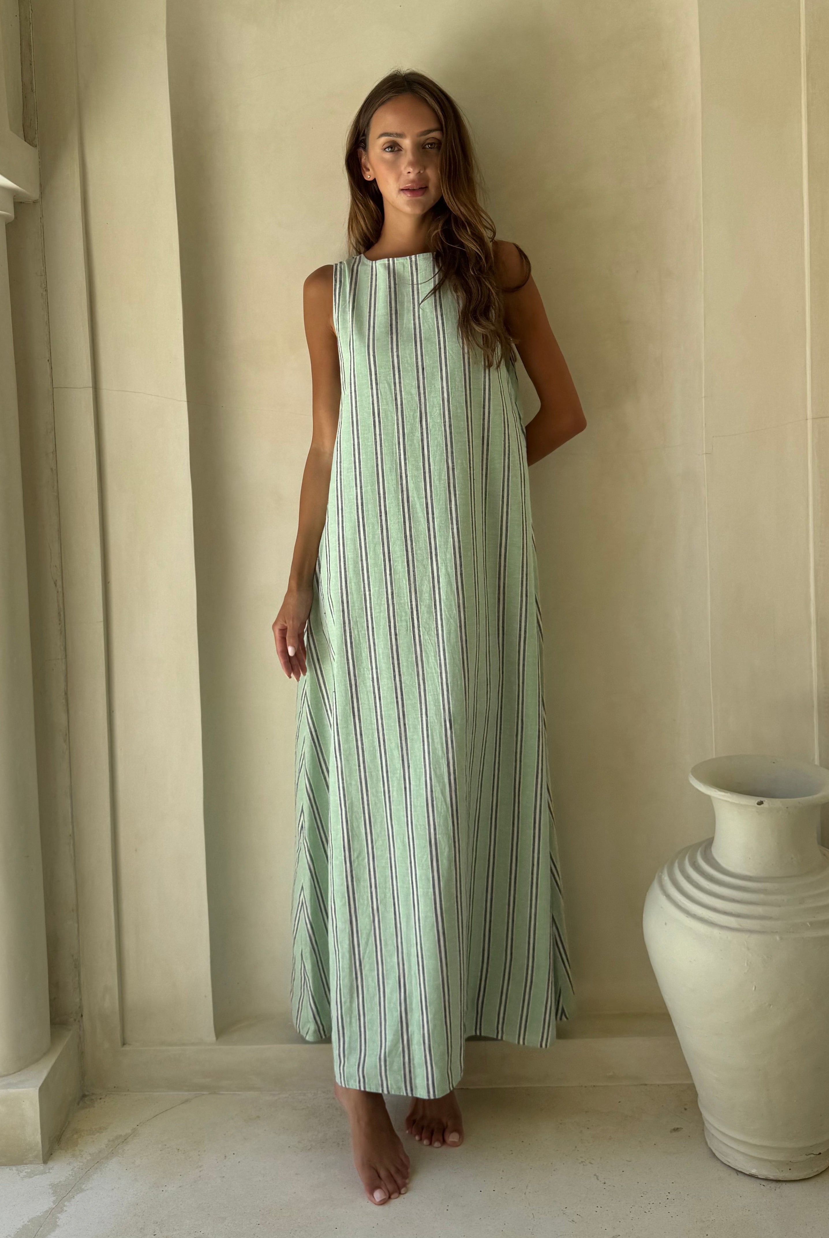 Front view of the Puka Label Gili Maxi Dress in green, navy and white stripe with convertible high neck neckline