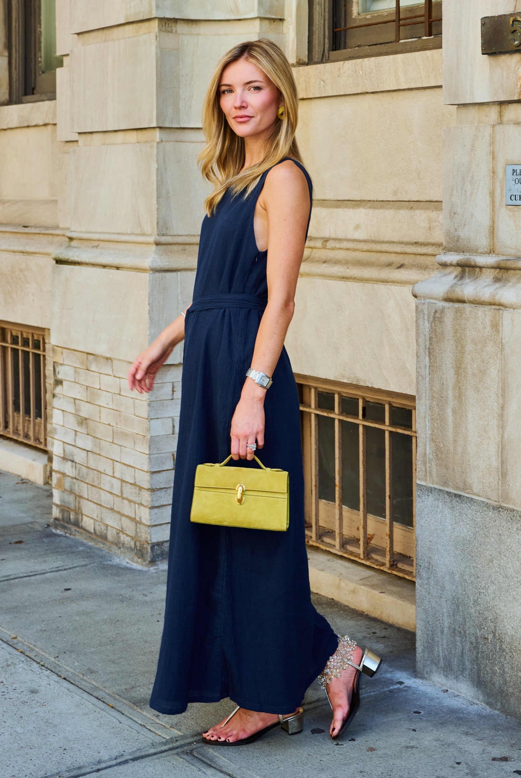Natalie Simkins in the Puka Camilla Dress Midnight navy β one-shoulder maxi, UES NYC street, chartreuse bag