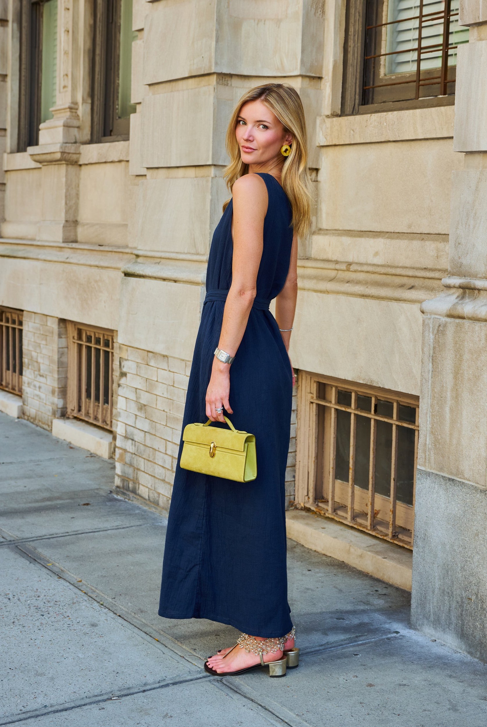 Natalie Simkins in the Camilla Dress Midnight, full-length view with self-tie belt, NYC sidewalk