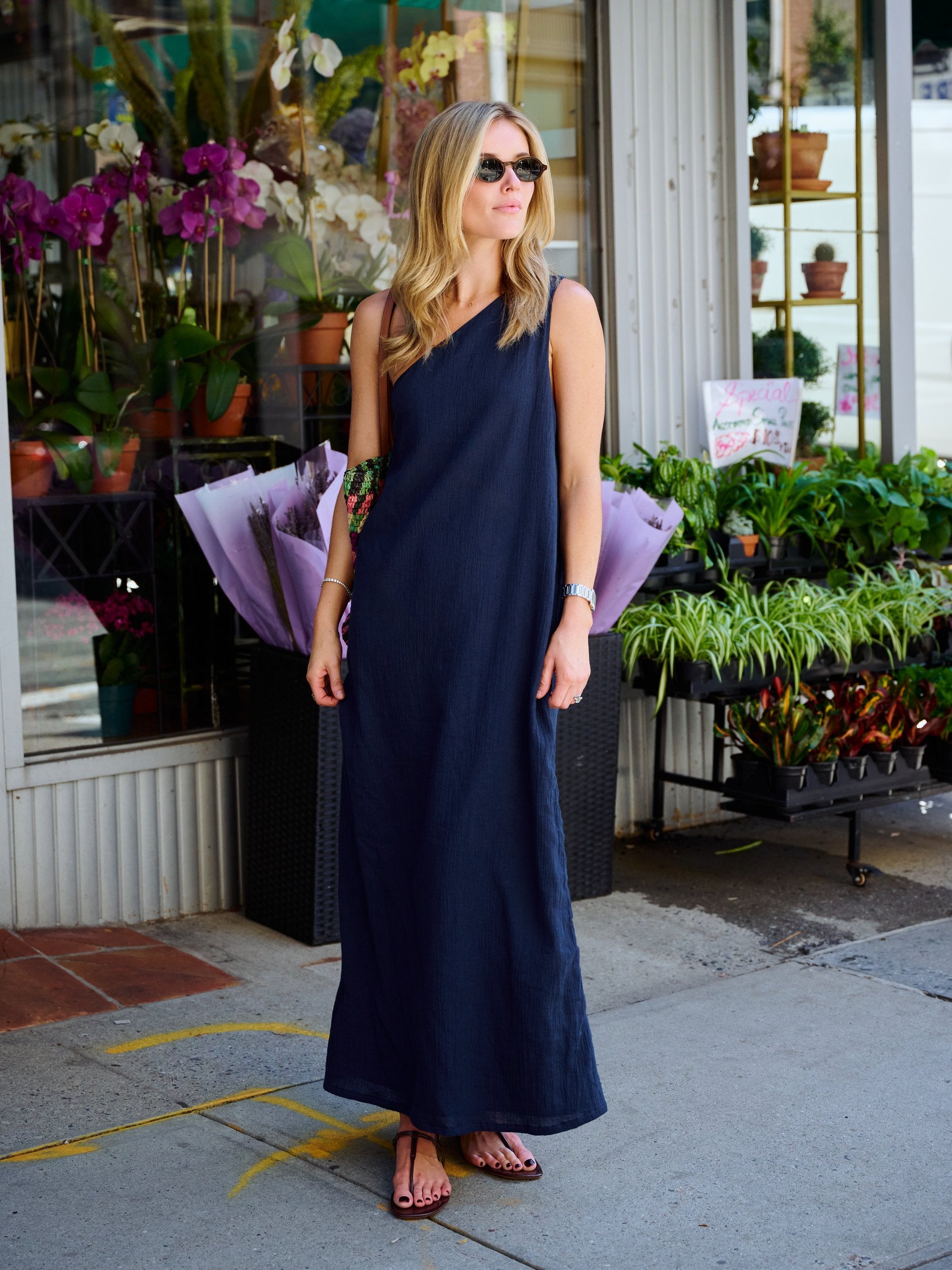 Full-length view of Puka Camilla Dress Midnight — one-shoulder asymmetric neckline, NYC flower market