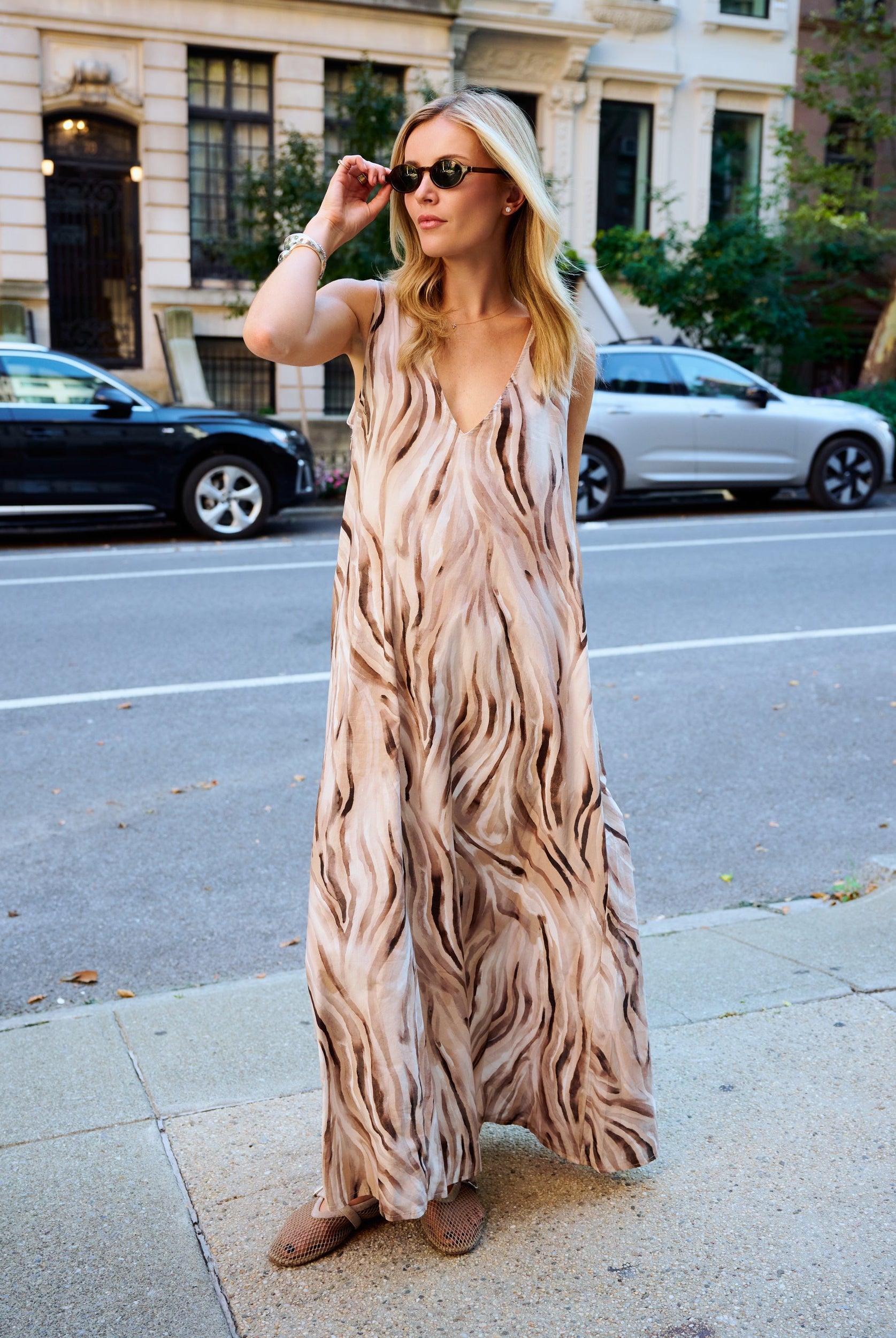 Natalie Simkins wearing the Puka Cleo in Brown Zebra β sleeveless V-neck maxi dress, UES NYC street
