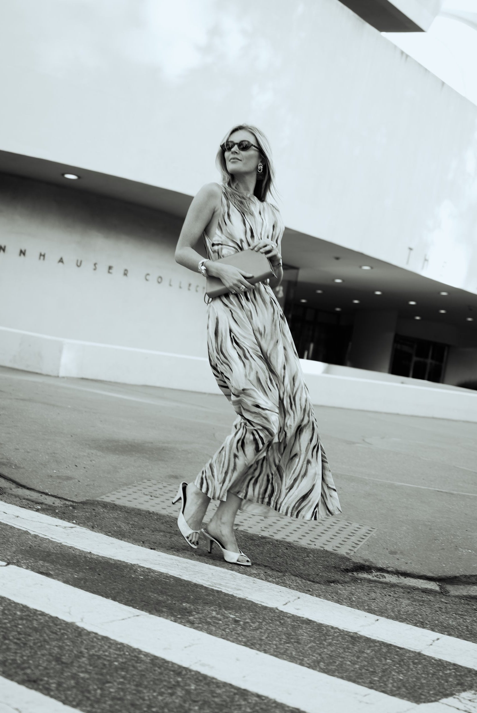 Natalie Simkins in the Puka x Natalie Simkins Cleo maxi dress in Brown Zebra print, NYC