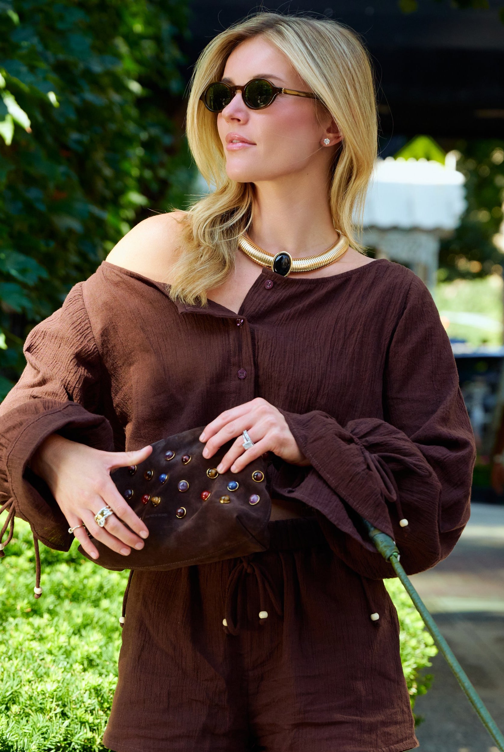 Natalie Simkins in the Colette Set Espresso close-up β off-shoulder balloon sleeve top with pearl bead cuffs
