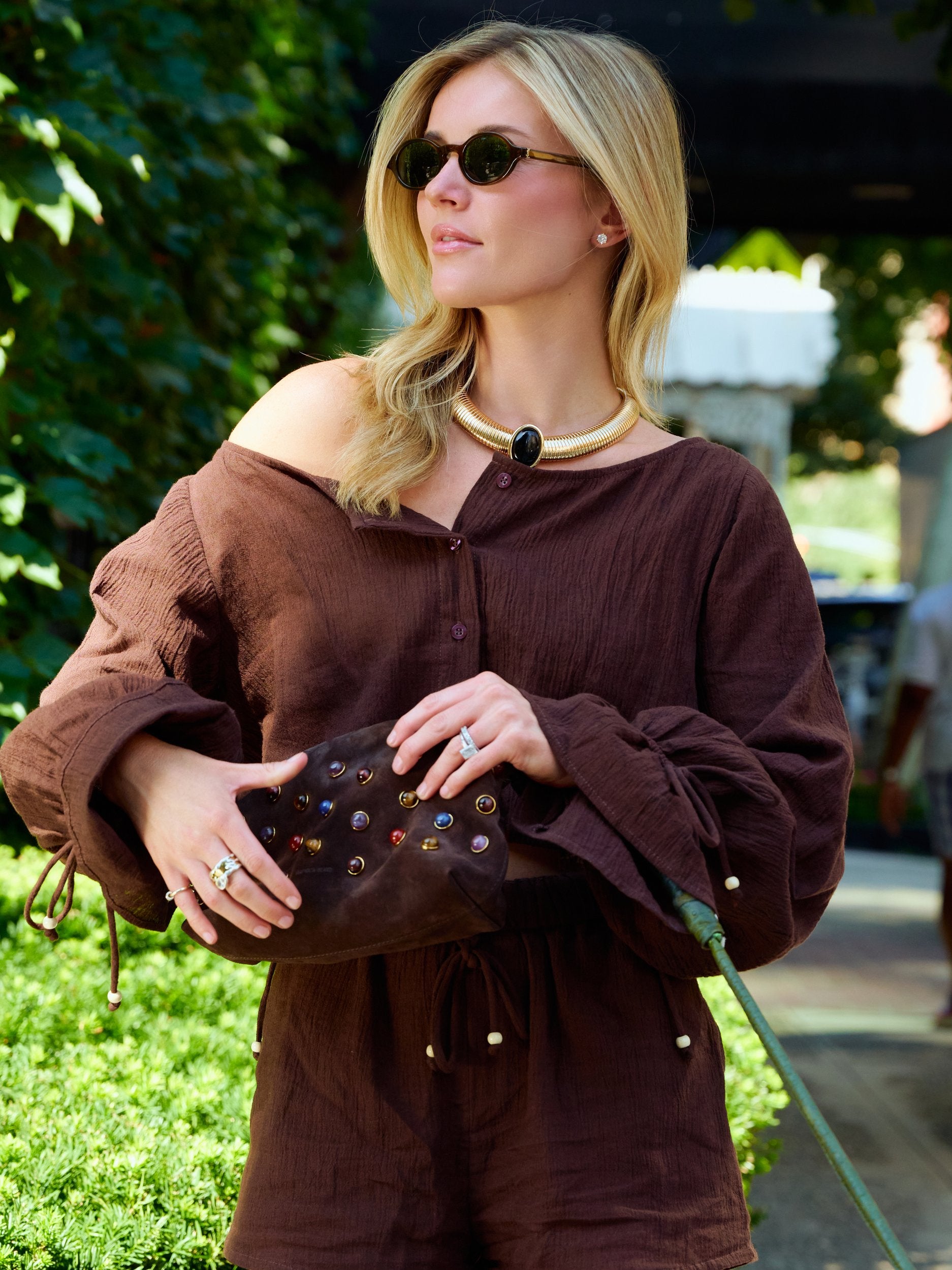 Natalie Simkins in the Colette Set Espresso close-up — off-shoulder balloon sleeve top with pearl bead cuffs