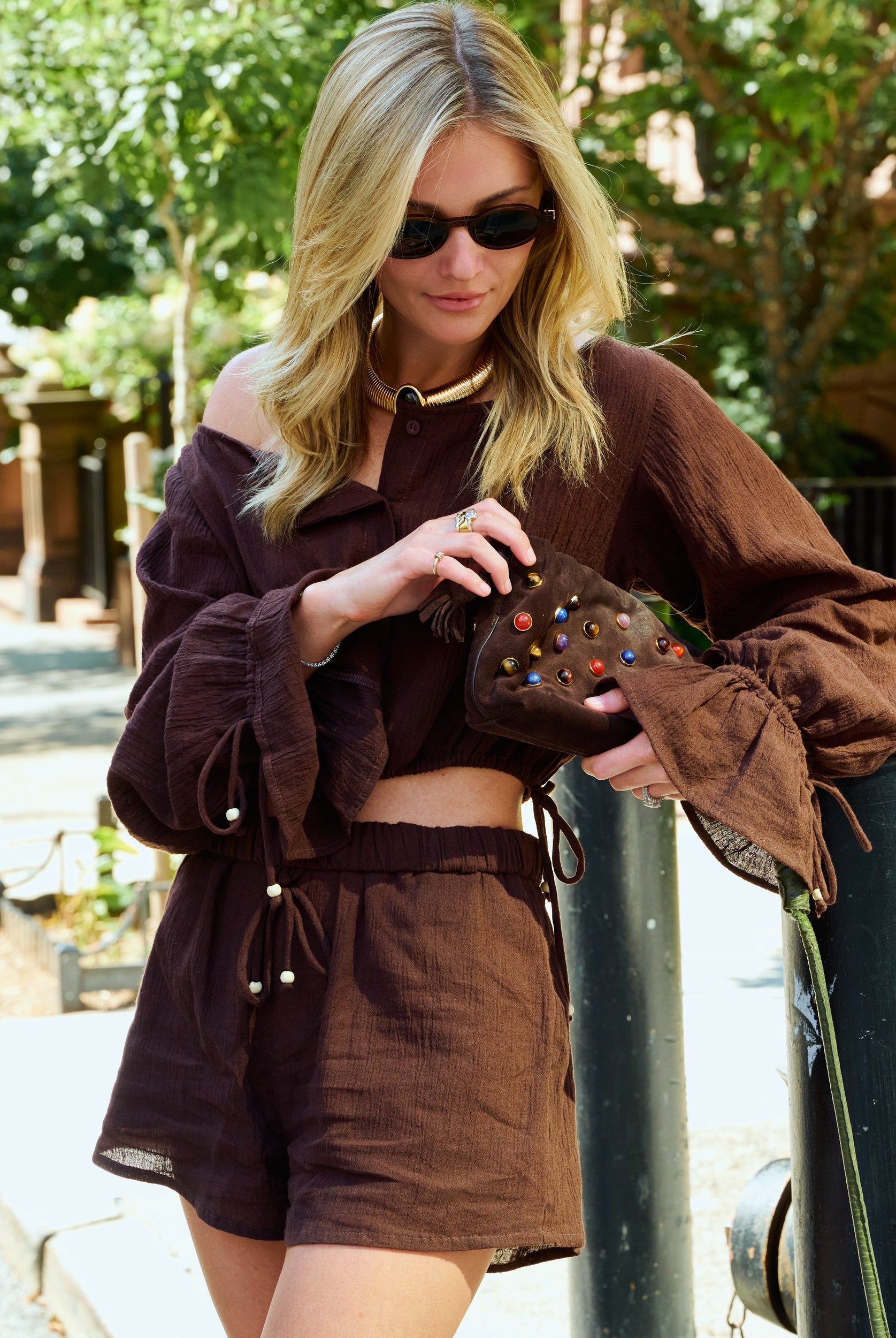 Natalie Simkins crossing NYC street in the Colette Set Espresso with her dog and NYC yellow taxi