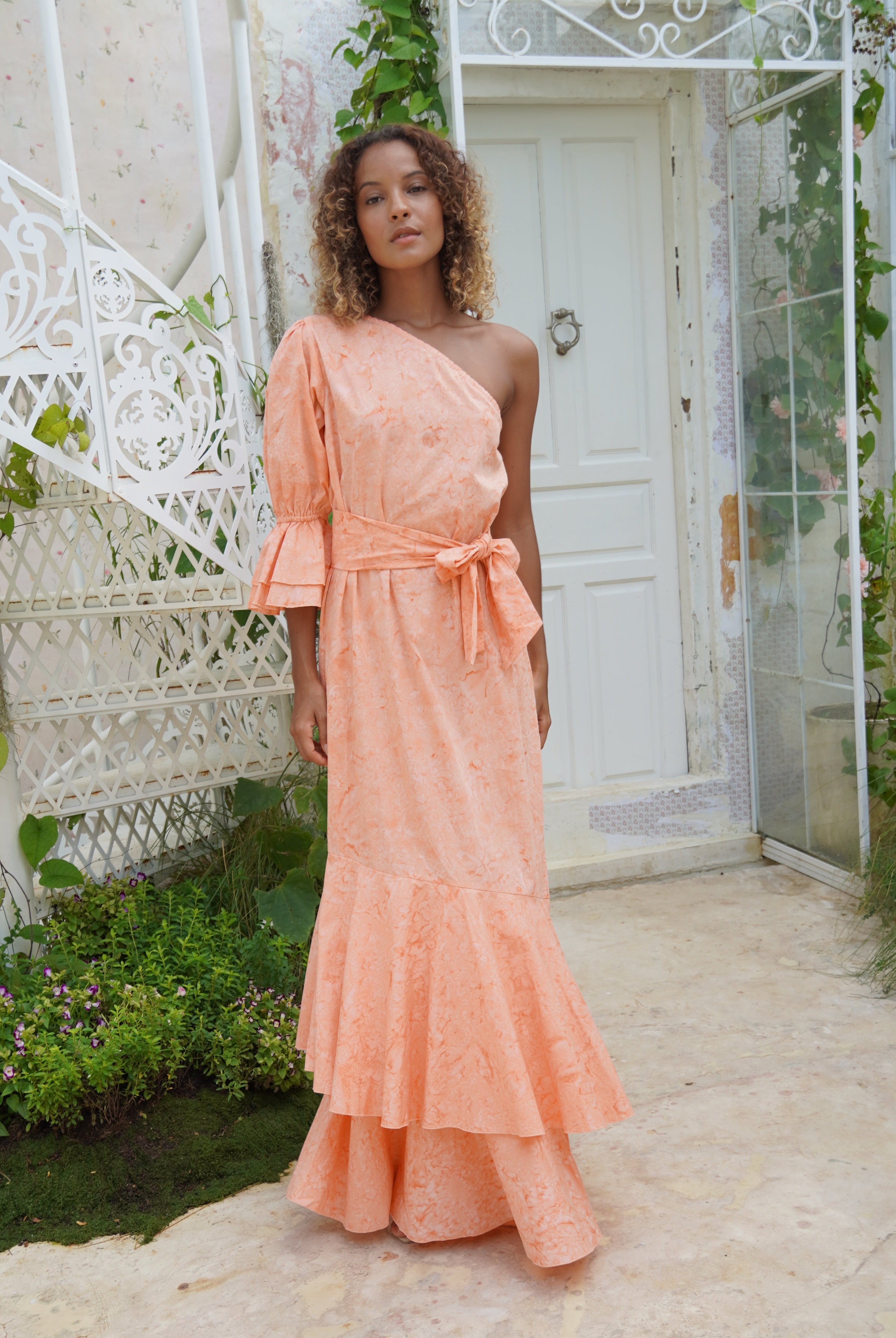 Peach feminine wedding guest dress inspired by the garden. Soft dresses to wear at a tea party or in the summer at a wedding