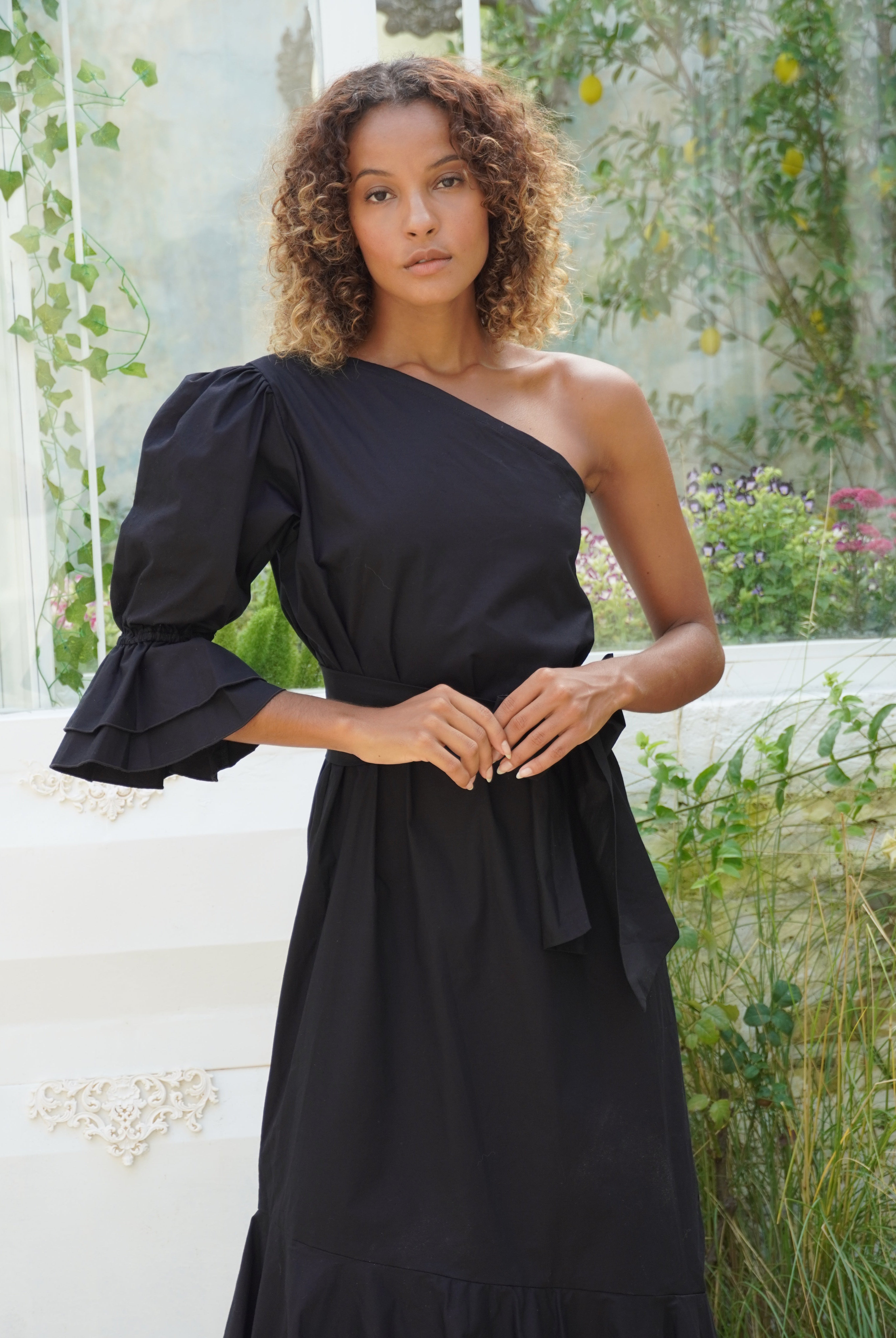 Unique black tie wedding guest dress idea 2026, black ruffle one shoulder maxi dress elegant and chic