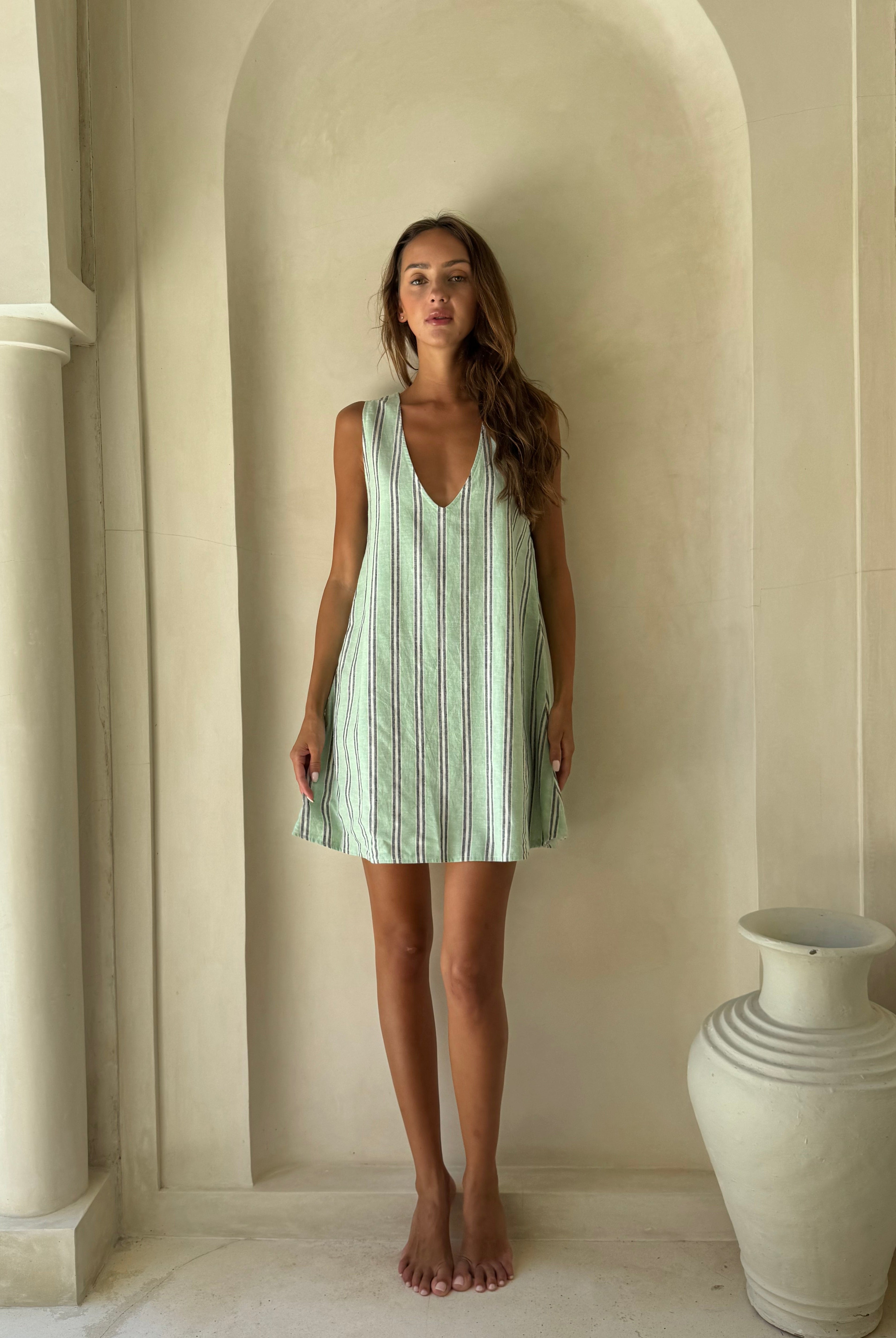 Vibrant green stripe mini dress Miami and Palm Beach resort outfit 2026, bright beach inspired preppy dress for tropical vacation and waterfront occasion