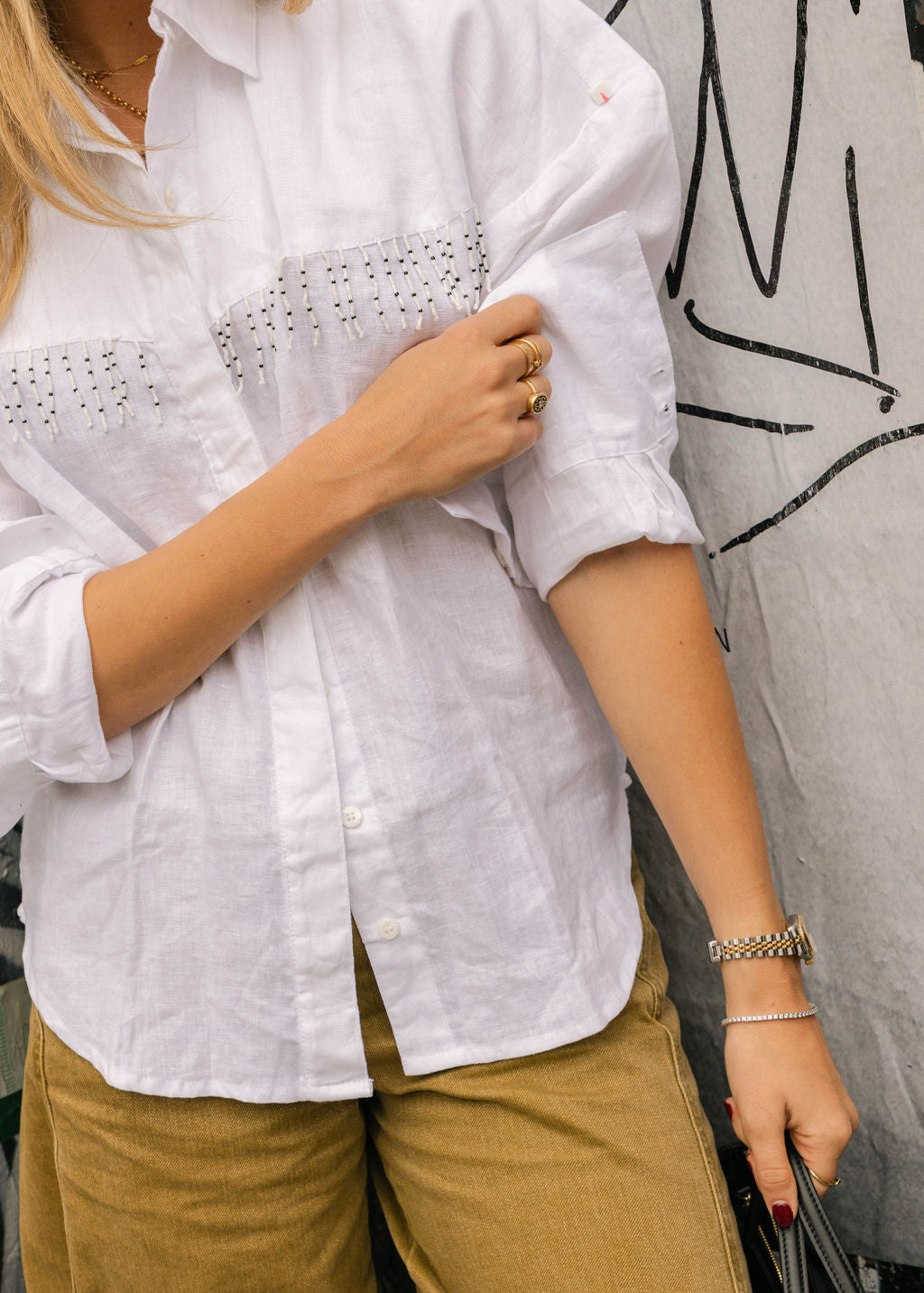 The perfect answer to what to wear to Round Top Texas — white linen fringe western shirt with bold black and white beaded fringe by Puka The Label