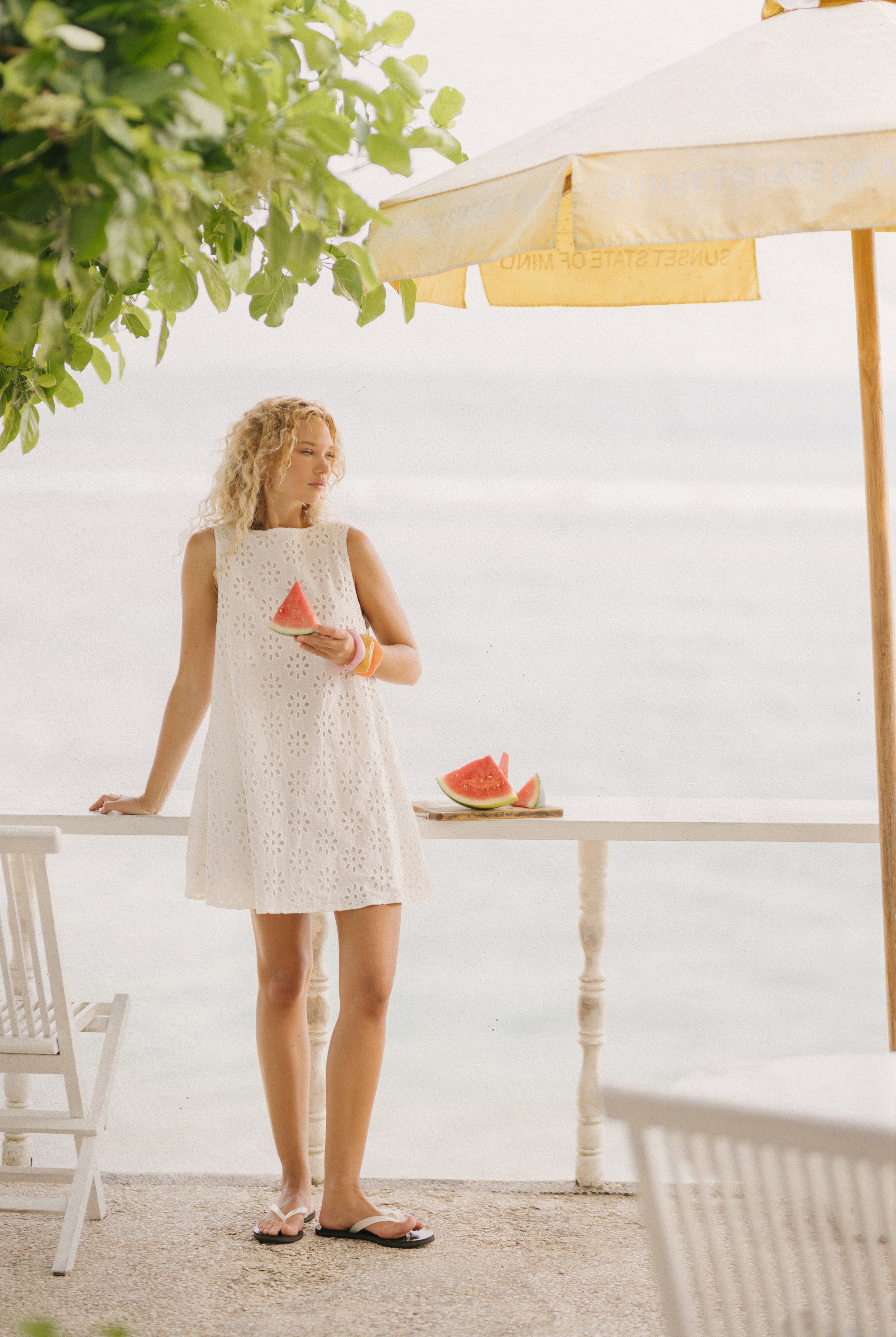 White floral eyelet cotton mini dress Anna Maria Island Florida spring outfit 2026, feminine reversible Mini Gili dress for Gulf Coast beach vacation