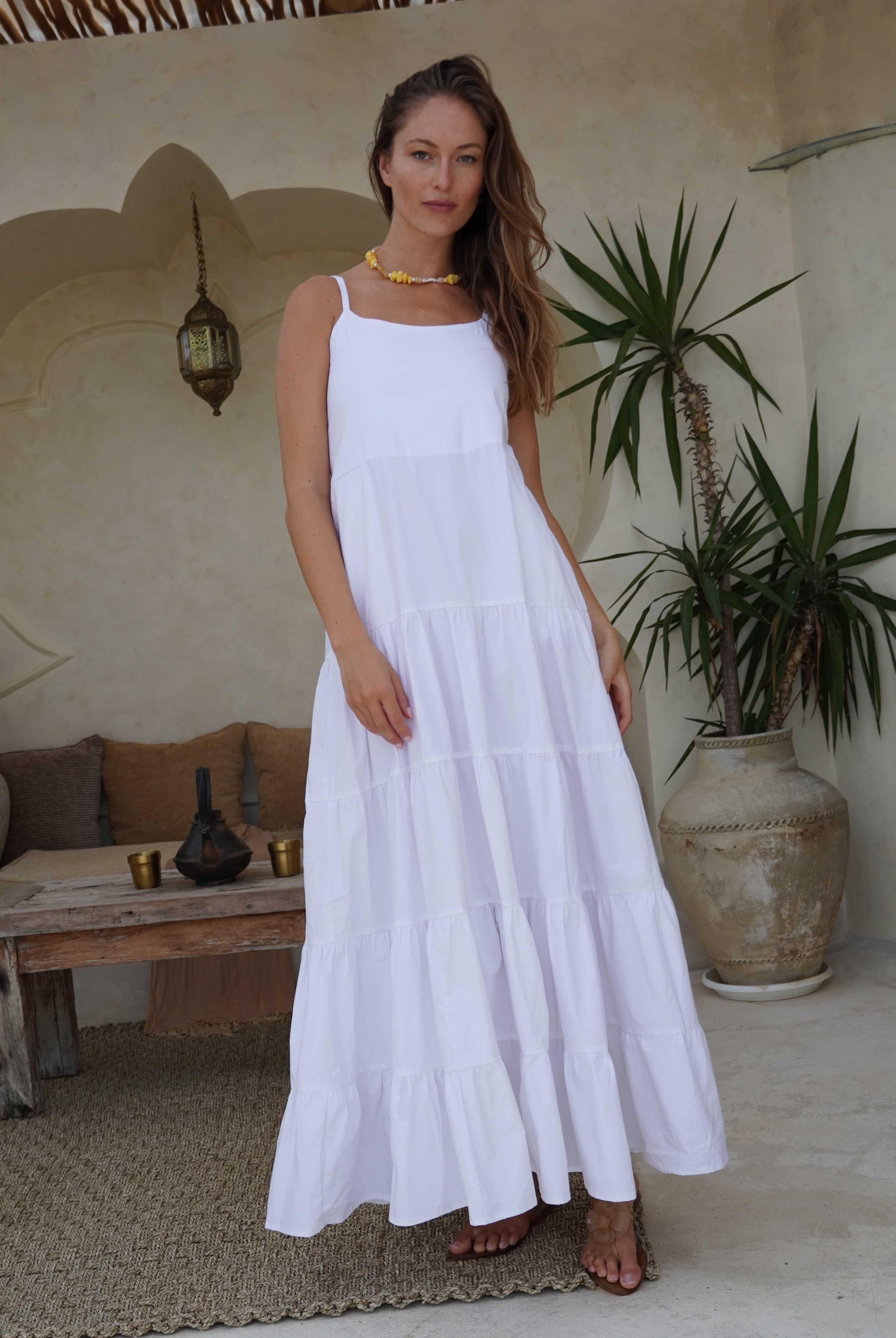 White flowy tiered cotton maxi dress baby shower and bridal event outfit 2026, elegant adjustable strap dress for feminine summer celebration