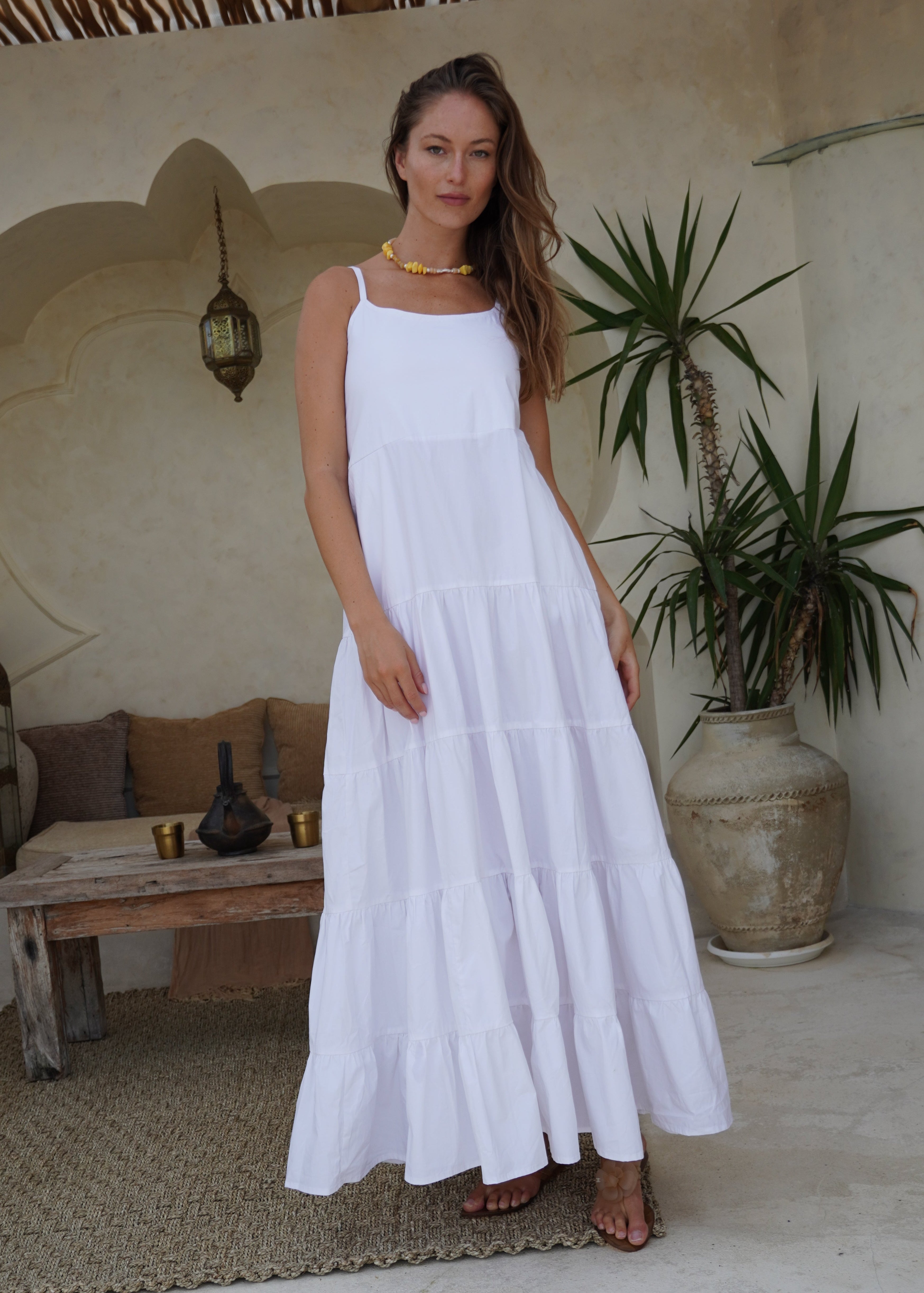 White flowy tiered cotton maxi dress baby shower and bridal event outfit 2026, elegant adjustable strap dress for feminine summer celebration