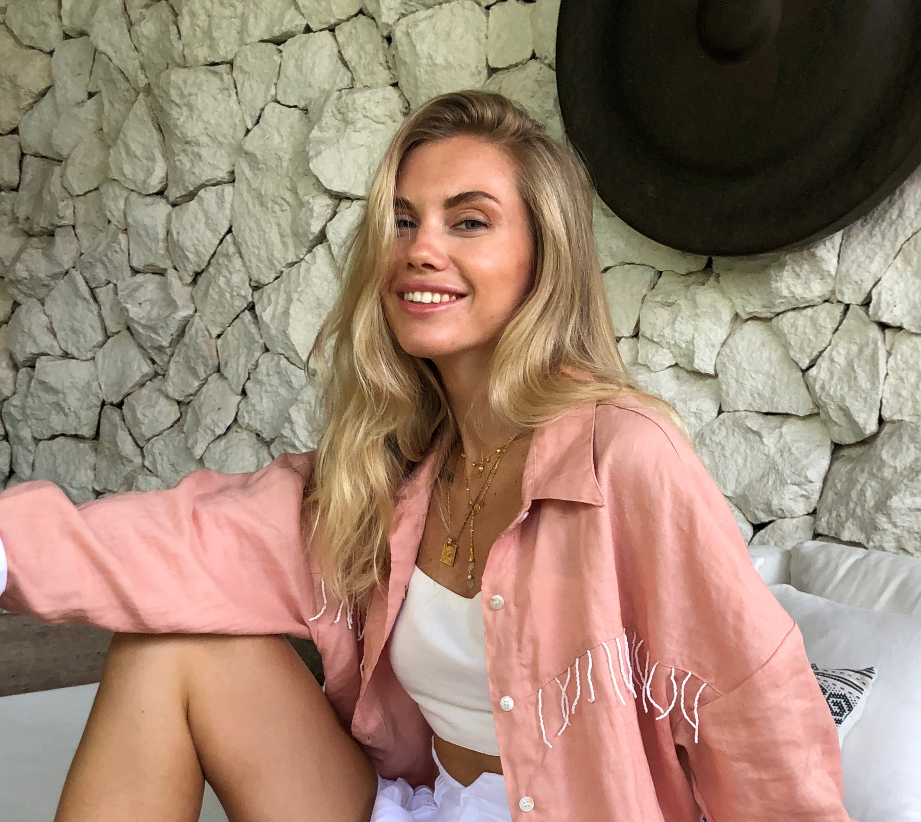 Peach fringe blouse by Puka The Label worn in a ranch style look — elevated western button-up for fall occasions