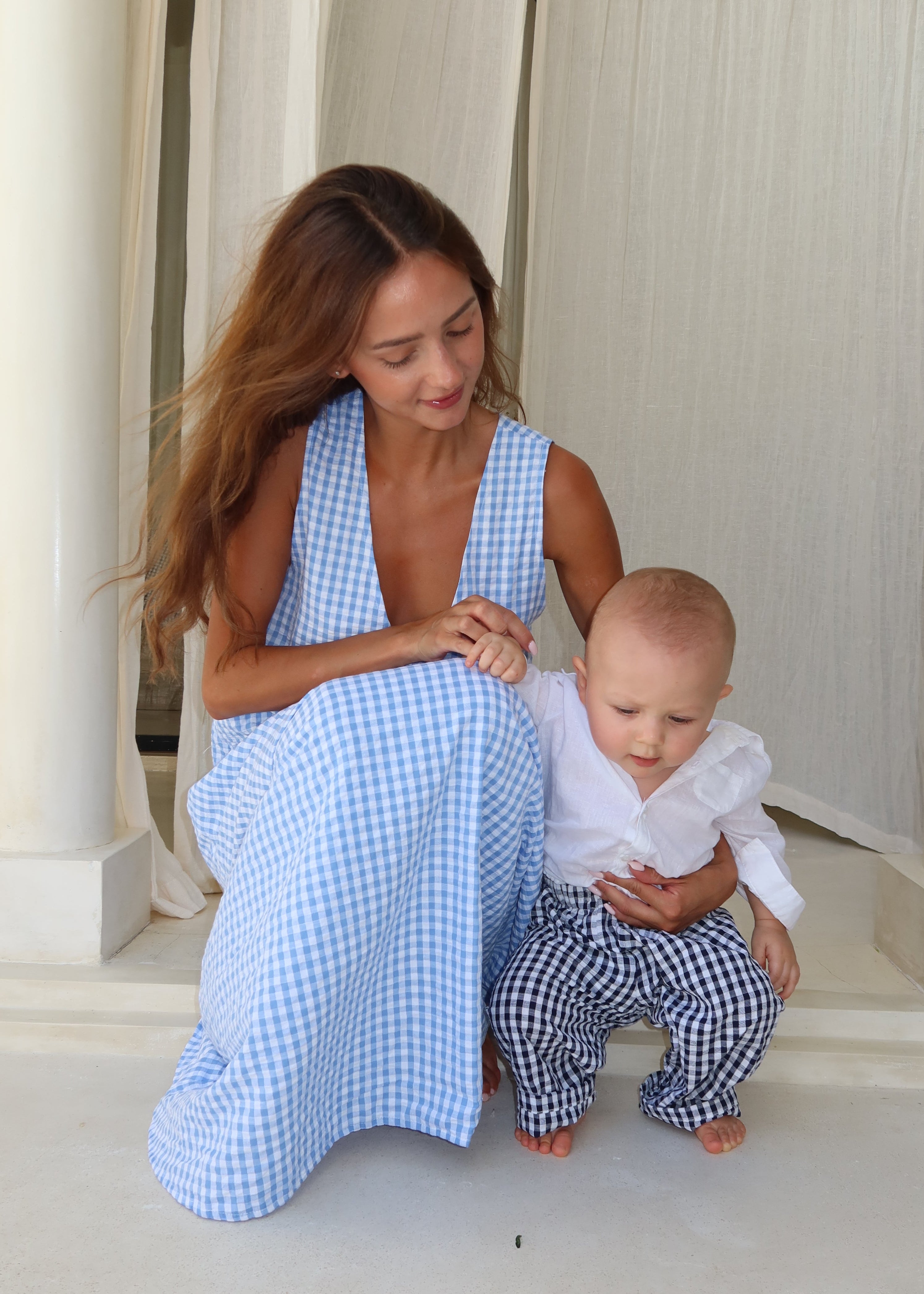 Mommy and Me photoshoot with mom and baby boy. Similar outfits that are slightly different for a family photoshoot