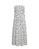 White strapless dress with black polka dots on a white background