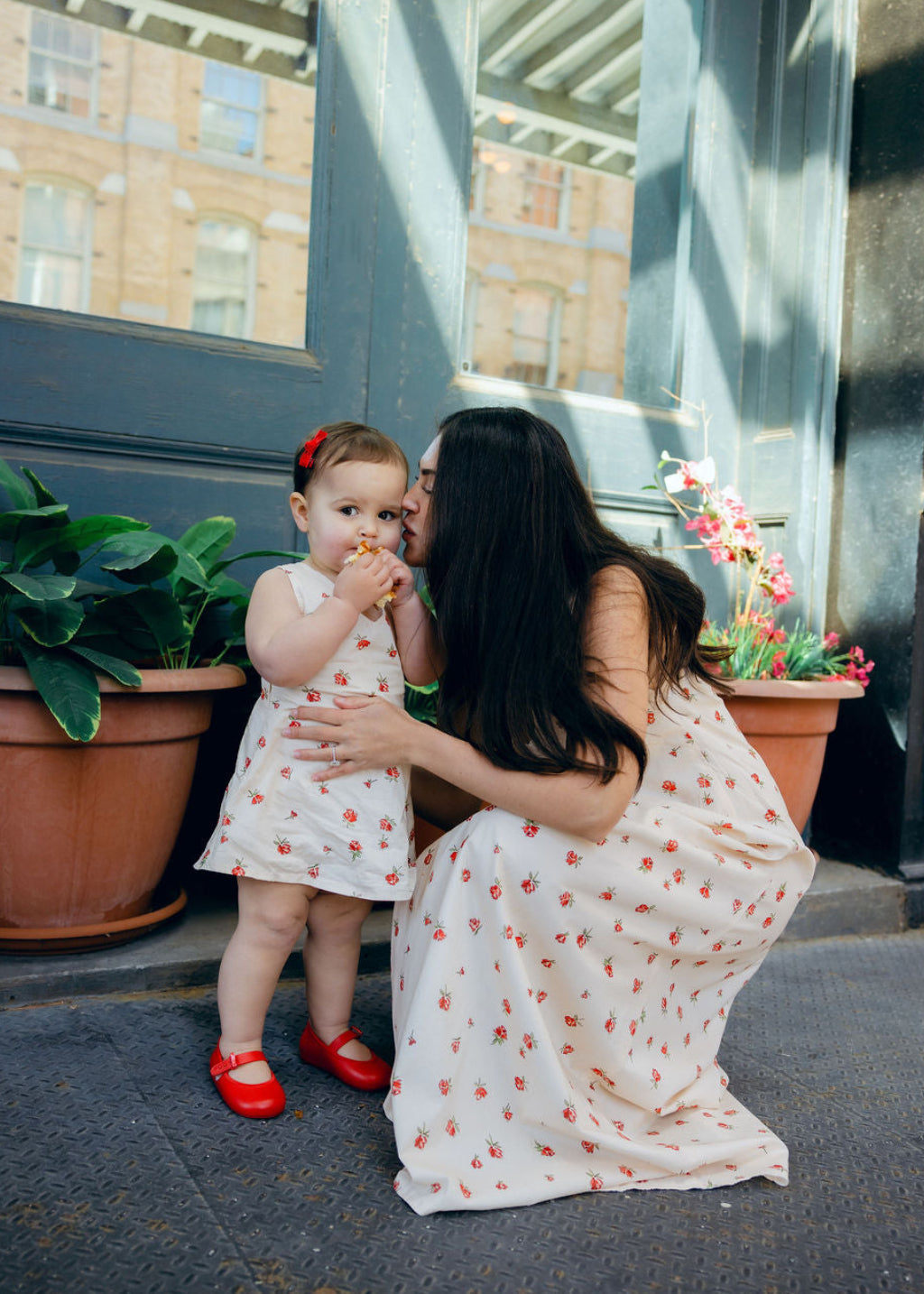 Mommy and Me matching Red Posey floral dresses at cafe brunch, Little Gili toddler girls spring Easter dress by Puka The Label