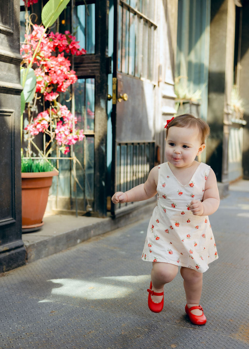 Full length Mommy and Me matching Red Posey floral dresses outdoors, Little Gili girls spring summer Easter kids dress by Puka The Label