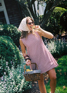 Influencer Hannah Lovey Style wearing red gingham mini dress by Puka The Label styled in the Hamptons, summer outfit, casual beach dress, influencer fashion