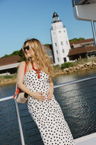 Loren Midi Dress in black and white polka dot at Montauk Yacht Club lighthouse — full length nautical summer dress, Montauk NY outfit idea 2026