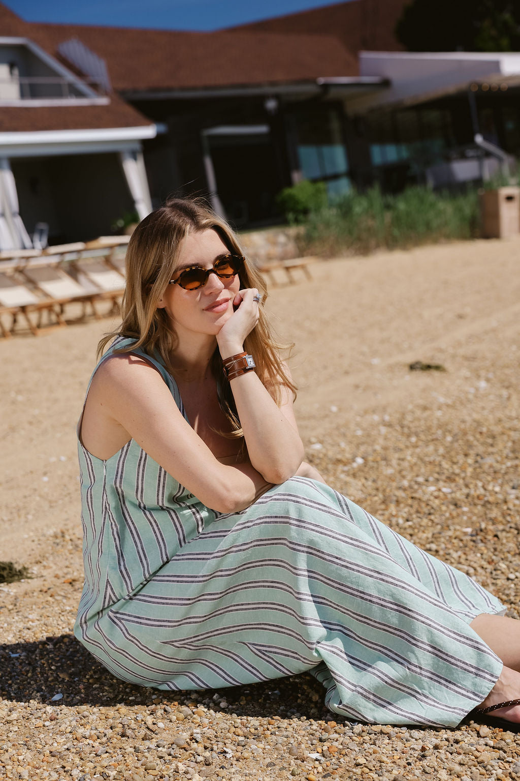 Green stripe Gili Maxi Dress relaxed on beach at Montauk Yacht Club — Hamptons beach dress outfit, easy nautical maxi dress for East End summer weekends